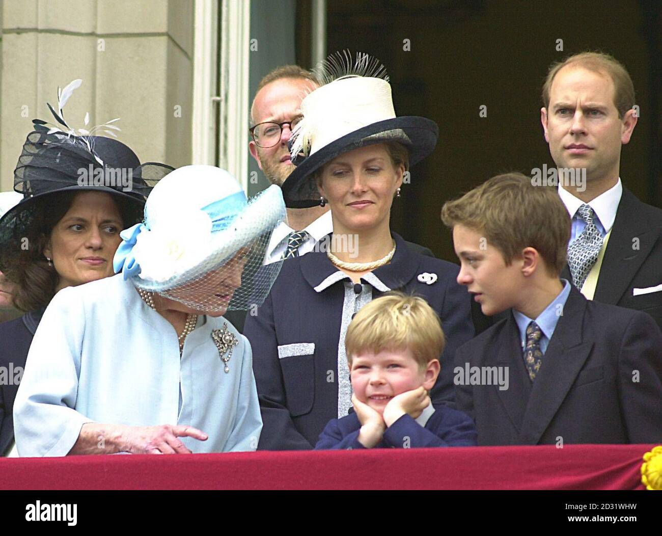 (Front l/r), Queen Elizabeth the Queen Mother, chats with the children of The Duke and Duchess of Kent's daughter, Cassius and Columbus, (rear l/r) Lady Helen Taylor and her husband Tim Taylor - parents of the children - the Countess of Wessex and the Queen's youngest son the Duke of Wessex, on the balcony of Buckingham Palace after the annual Trooping of the Colour parade in London's Horse Guards parade. The parade marks the Queen's official birthday. Stock Photo