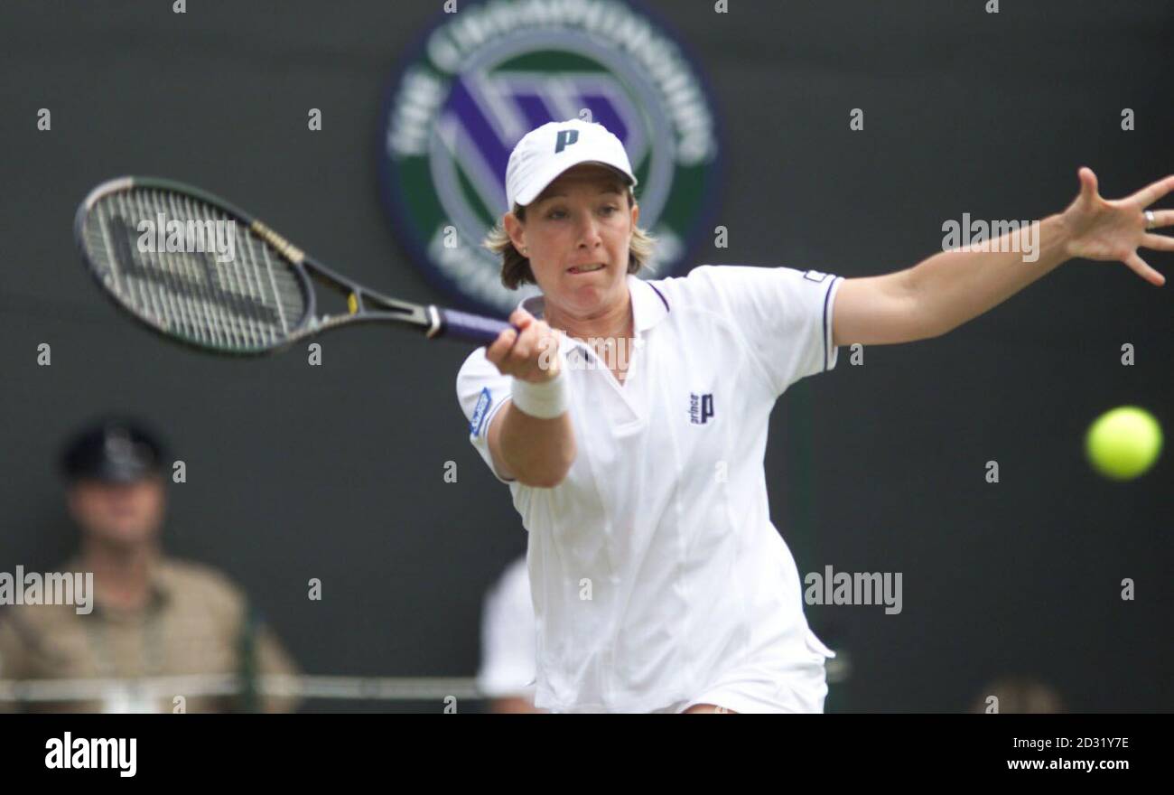 NO COMMERCIAL USE: Lisa Raymond of USA in action against Belgium's Justine Henin during their Second Round match of the 2001 Lawn Tennis Championships at Wimbledon, London. Stock Photo