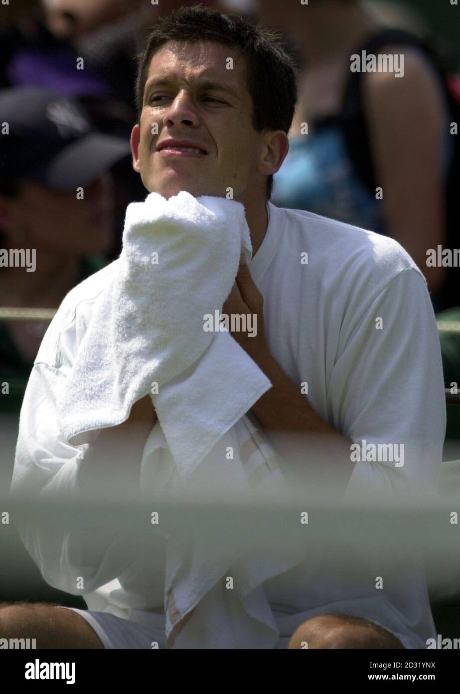 NO COMMERCIAL USE: British tennis star Tim Henman takes a break during a practice session before his match against America's Todd Martin  at Wimbledon, London. Stock Photo