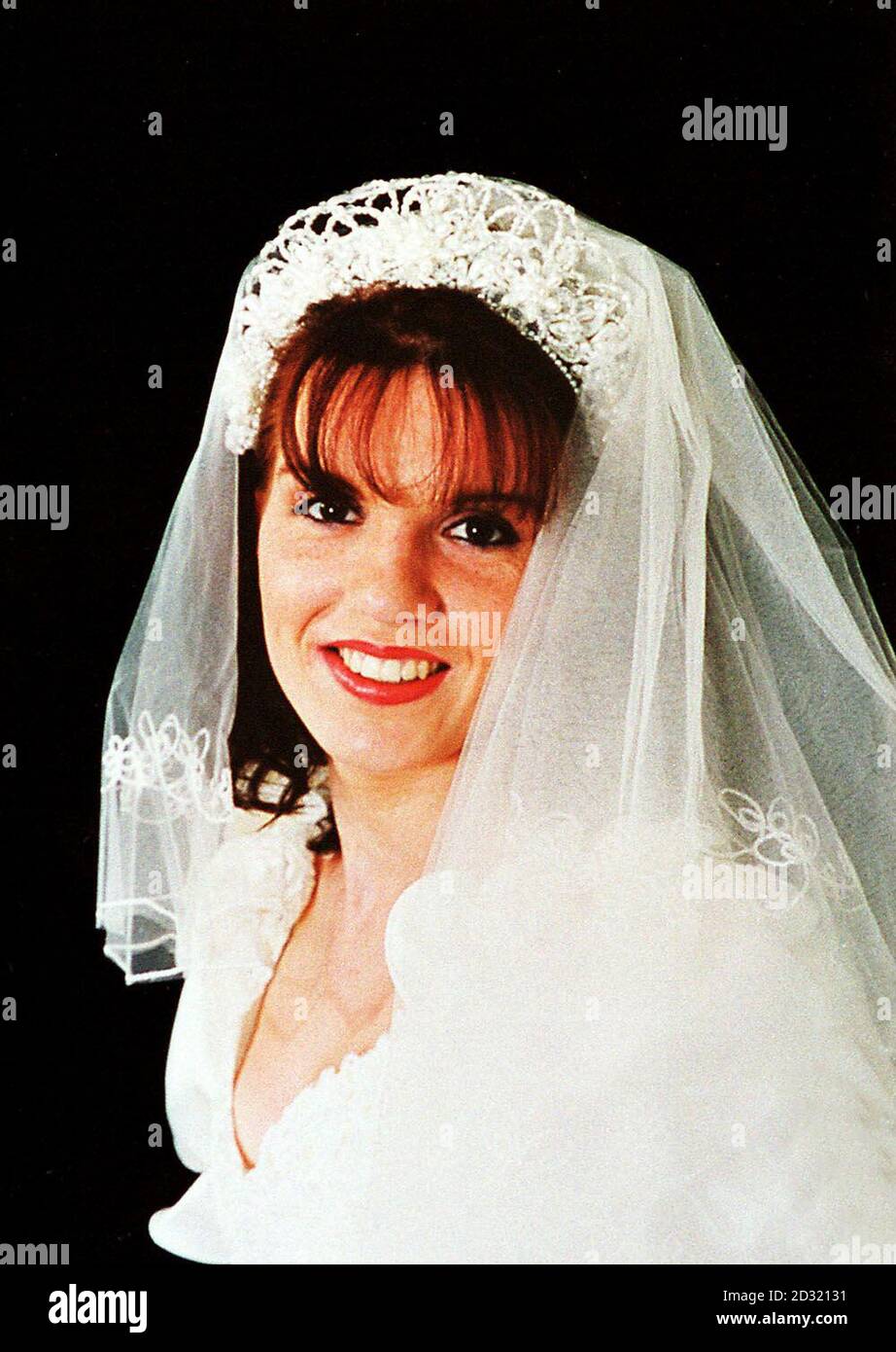 Collect picture of Beverley Payne a mother-of-two, from Neath, South Wales, pictured wearing a wedding dress as a modelling assignment. Ms Payne who was stabbed to death at her home. * .., beleive a man found in a silver Mercedes car, submerged in the city's Prince of Wales dock was associated with the young mother who was murdered, police said. Twenty detectives are now working on the murder enquiry from an incident room at Port Talbot police station. Police want to speak to anybody who may have seen his R-registered silver Mercedes in the docks area from 6.45am. *15/07/2001...Chris Davie Stock Photo