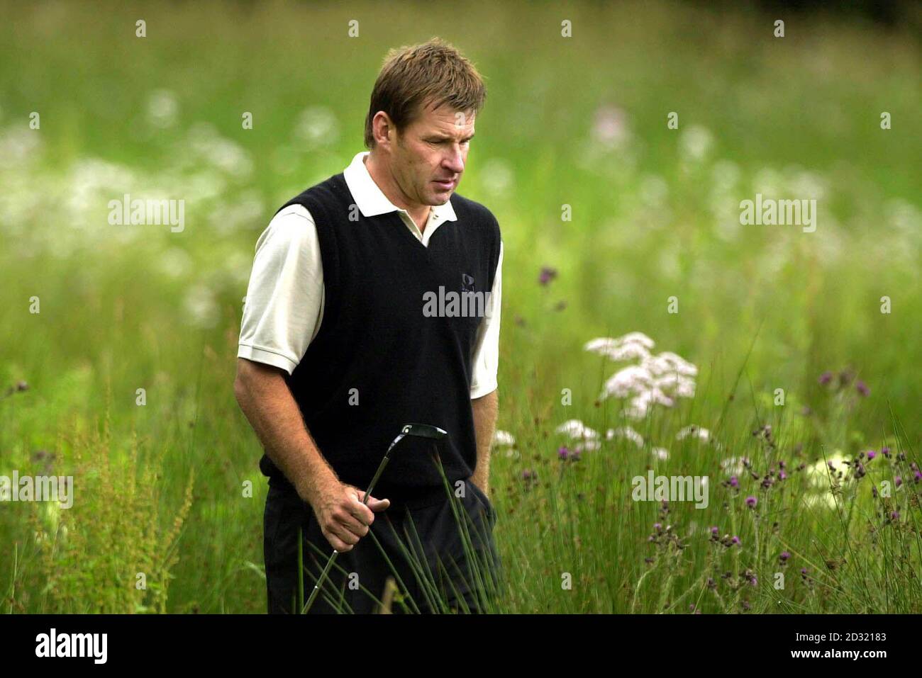England's Nick Faldo takes a long walk up the 17th green during the third day of the Scottish Open at Loch Lomond. Stock Photo