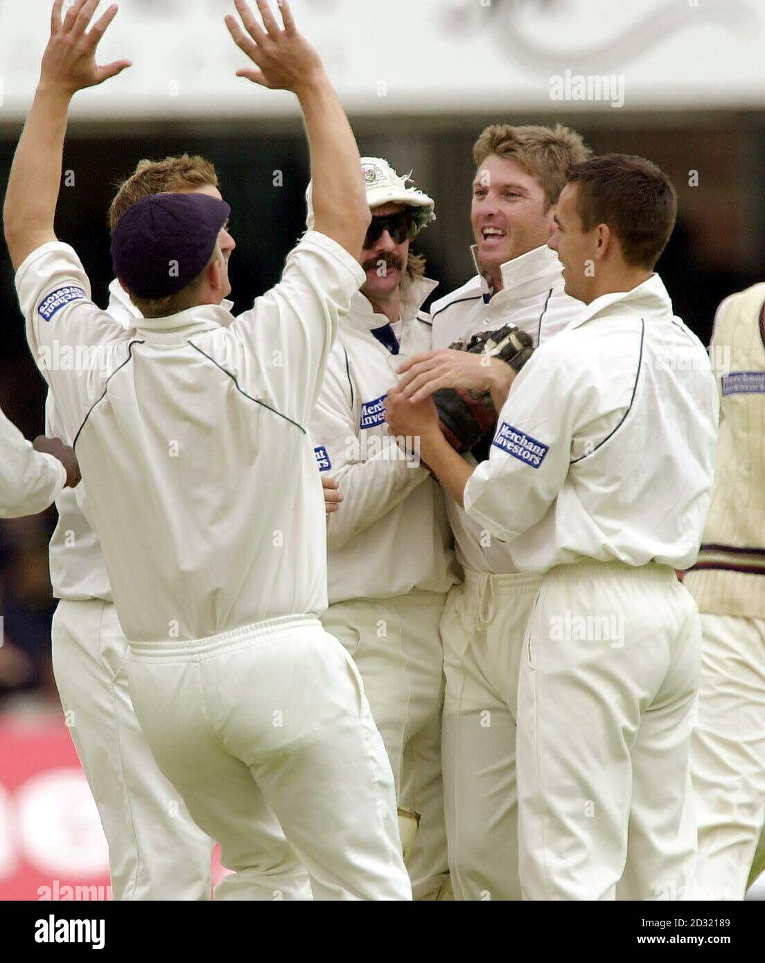 Gloucestershire's Ian Harvey (second right) celebrates with team-mates after trapping Surrey's Mark Butcher lbw for 0, during the B & H Cup Final at Lords, London. Stock Photo