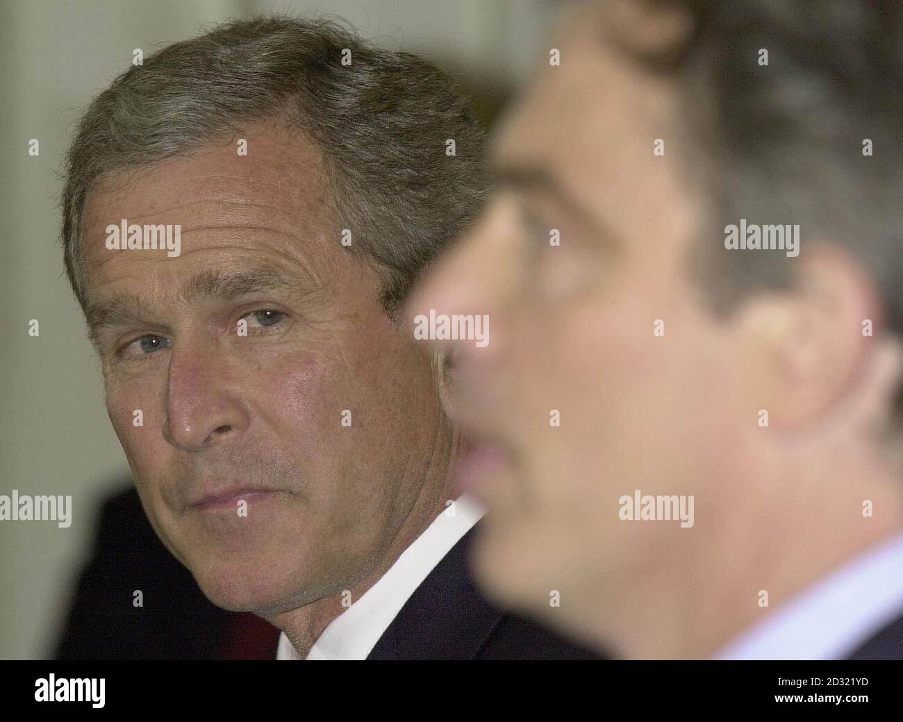 United States President George W Bush (L) and British Prime Minister Tony Blair during a media conference at RAF Halton. The press conference came after Mr Bush spent the day in Britain, prior to the G8 Genoa summit, which both leaders will attend. Stock Photo