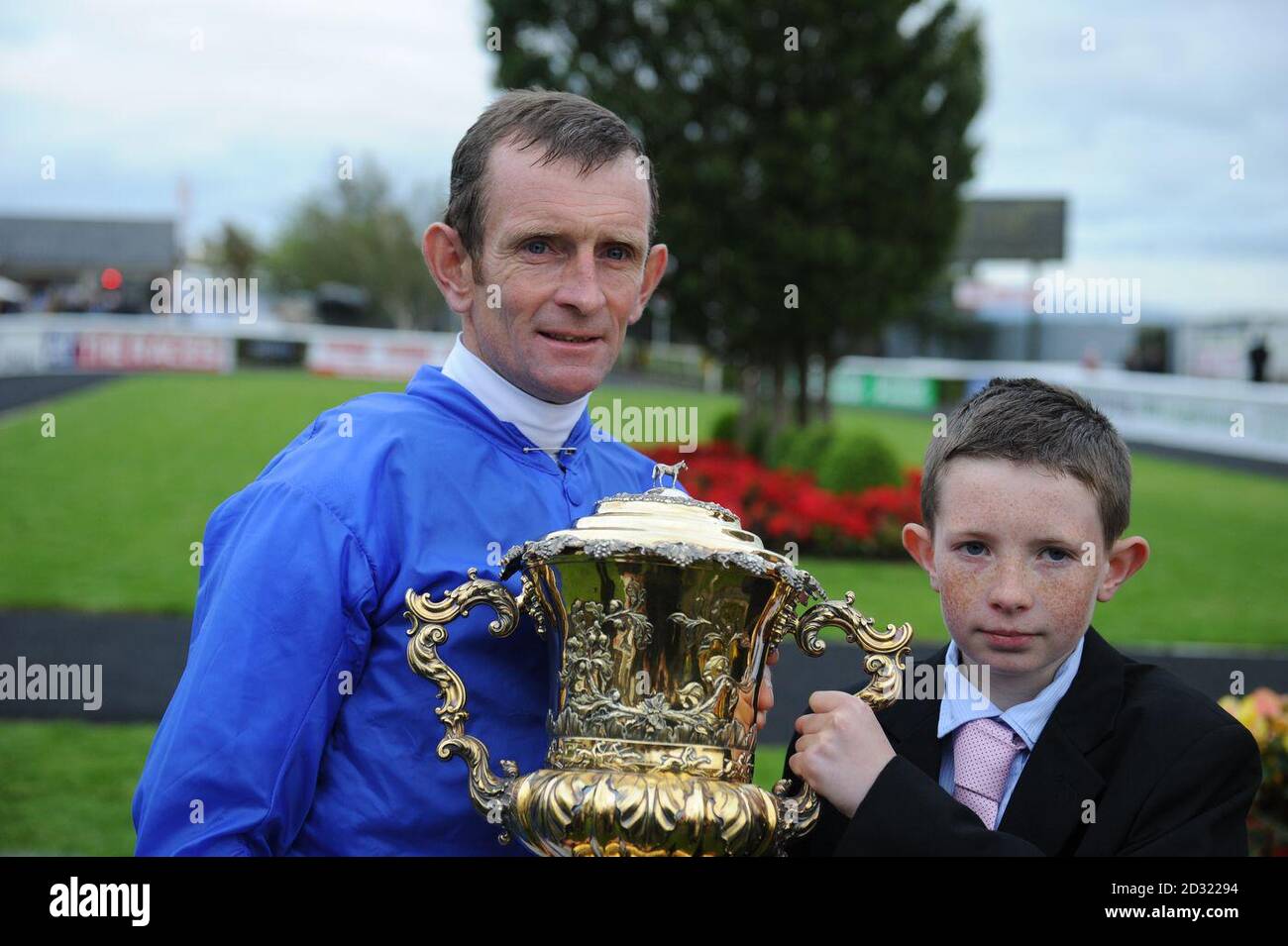 Kevin Manning poses with his son James after winning The Goffs Vincent O'Brien Stakes at Curragh Racecourse, Curragh. Stock Photo