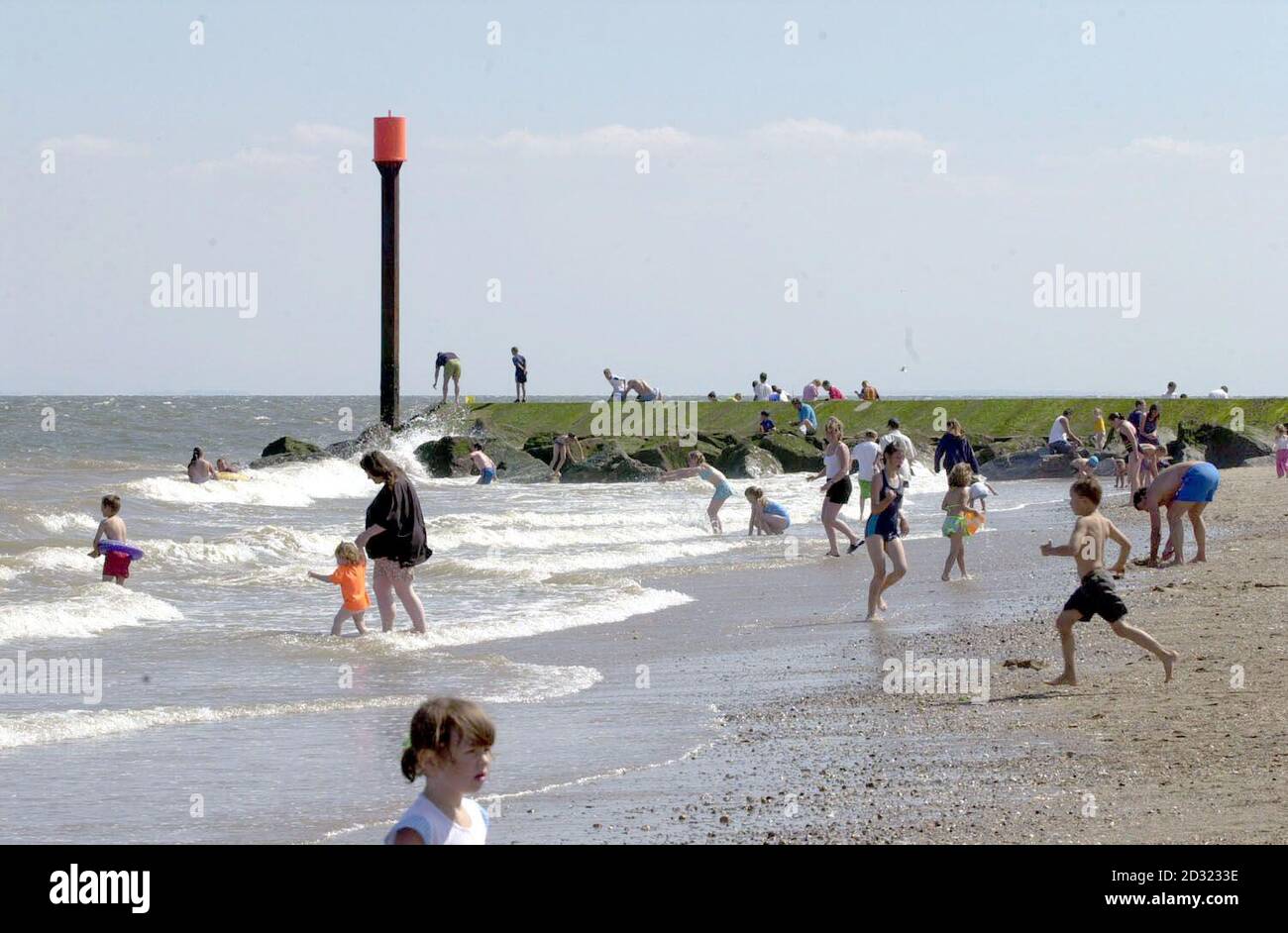 Holidaymakers sunbathe at Ingoldmells Point, near Skegness, Lincolnshire, by the sewage outlet where Rolls Royce worker, David Walsh died trying to save two boys who fell in the water whilst crab fishing. Stock Photo