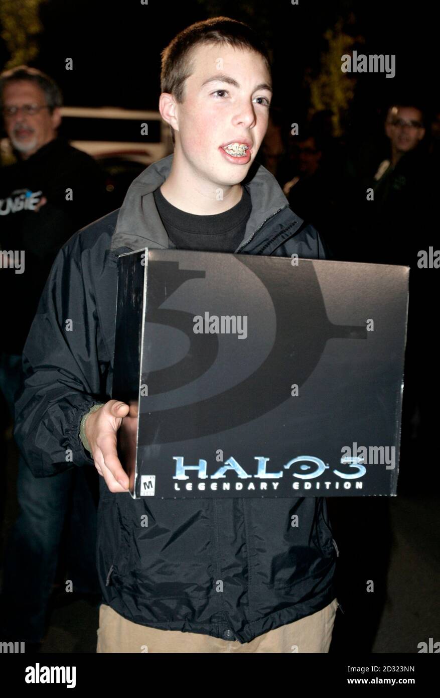 Matt Foulon leaves an electronics store in Bellevue Washington, after being  one of the first to purchase Microsoft's newest Xbox video game, Halo 3,  September 25, 2007. REUTERS/Robert Sorbo (UNITED STATES Stock