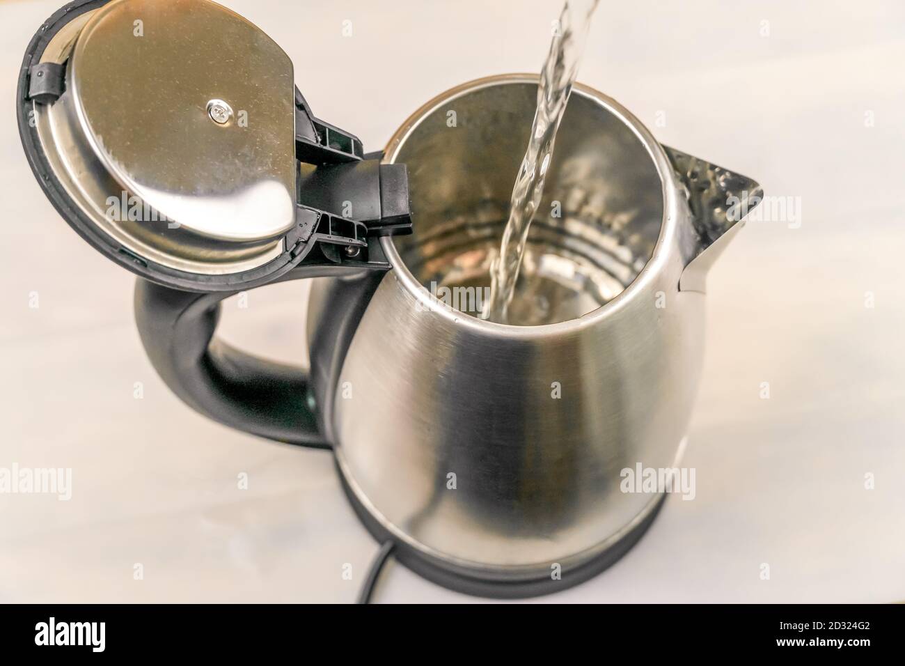 Filling Kettle With Water High Resolution Stock Photography and Images
