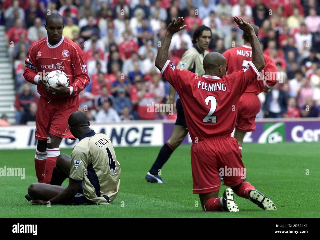 THIS PICTURE CAN ONLY BE USED WITHIN THE CONTEXT OF AN EDITORIAL FEATURE. NO WEBSITE/INTERNET USE OF PREMIERSHIP MATERIAL UNLESS SITE IS REGISTERED WITH FOOTBALL ASSOCIATION PREMIER LEAGUE. Middlesbrough's Paul Ince and Curtis Fleming appeal for a freekick from Arsenal's Patrick Vieira during the FA Barclaycard Premiership game at the Riverside Stadium. Stock Photo