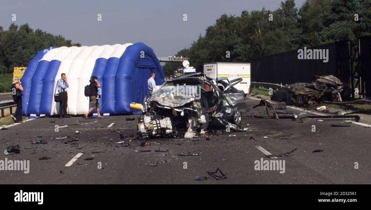 The wreckage of two burnt out cars at the A20 at Swanley, Kent where four people were killed. One car, being pursued by Surrey police officers investigating a burglary, was being driven at high speed in the wrong direction and collided head-on with the other vehicle. Stock Photo