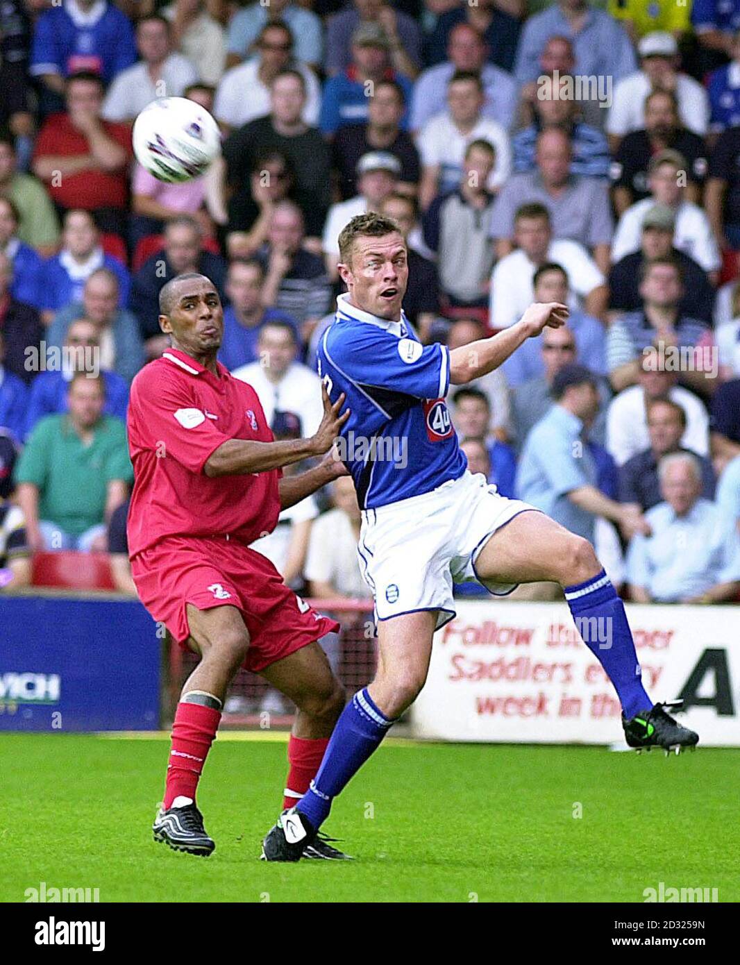 THIS PICTURE CAN ONLY BE USED WITHIN THE CONTEXT OF AN EDITORIAL FEATURE. NO UNOFFICIAL CLUB WEBSITE USE. Walsall's Harry Erivelto in action against Birmingham City's Geoff Horsfield (right) during the Nationwide Division One game at the Bescot Stadium, Walsall. Stock Photo