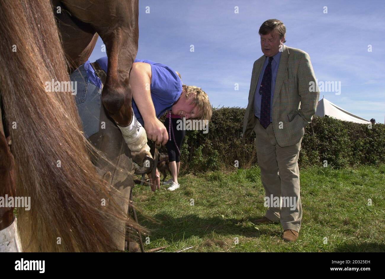 Tory Leadership candidate Kenneth Clarke observes a horse-shoe check at the Moorgreen County Fair in Nottinghamshire with farrier Caroline Woodward. Stock Photo
