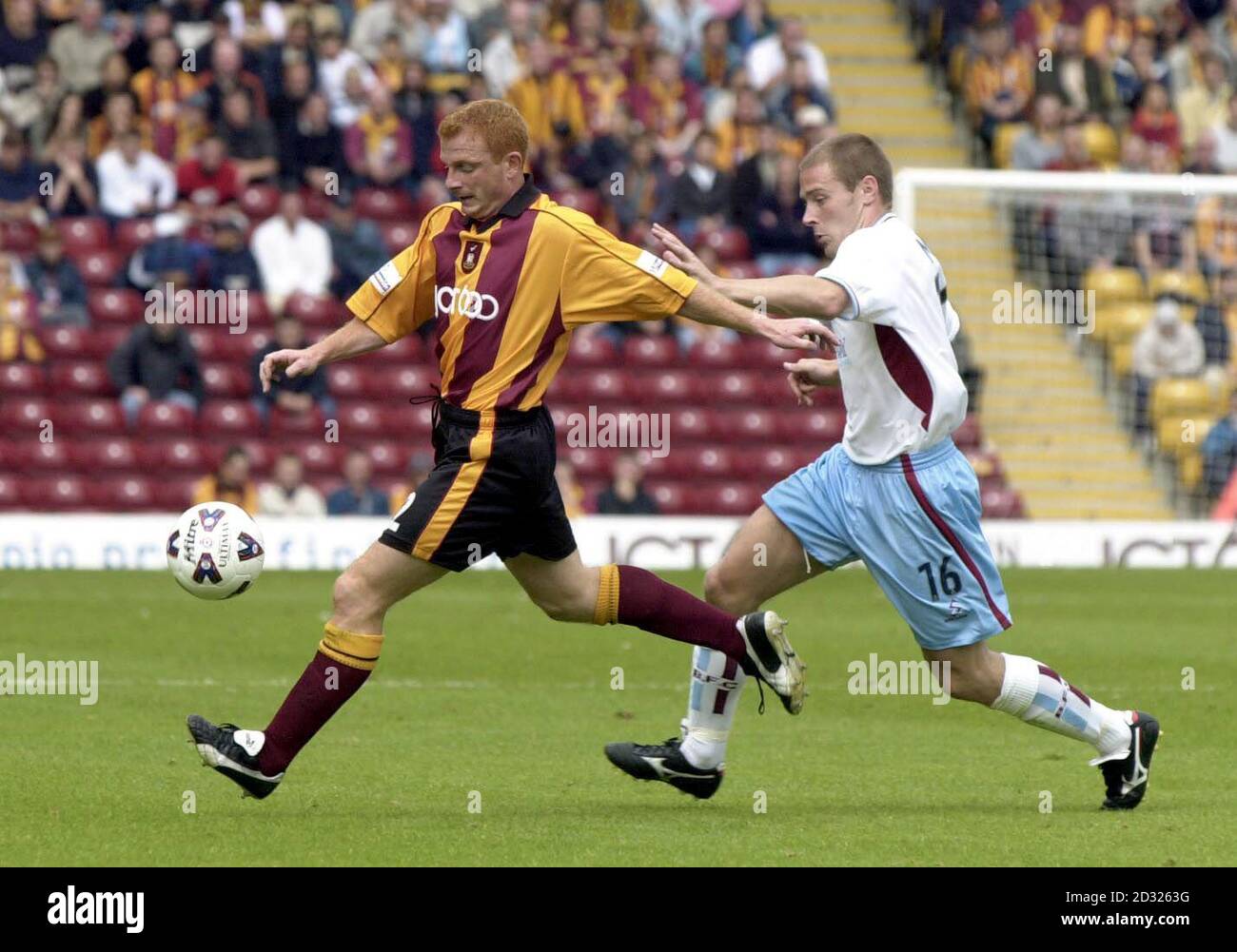 Bradford City's Wayne Jacobs (left) gets away from Burnley's Ian Moore during the Nationwide Division One game at Valley Parade, Bradford This picture can only be used within the context of an editorial feature. NO UNOFFICIAL CLUB WEBSITE USE. Stock Photo
