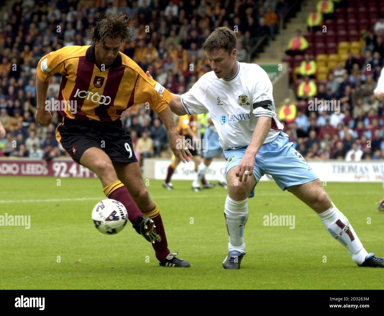 Bradford City's Ashley Ward (left) holds off Burnley's Steve Davis during the Nationwide Division One game at Valley Parade, Bradford This picture can only be used within the context of an editorial feature. NO UNOFFICIAL CLUB WEBSITE USE. Stock Photo