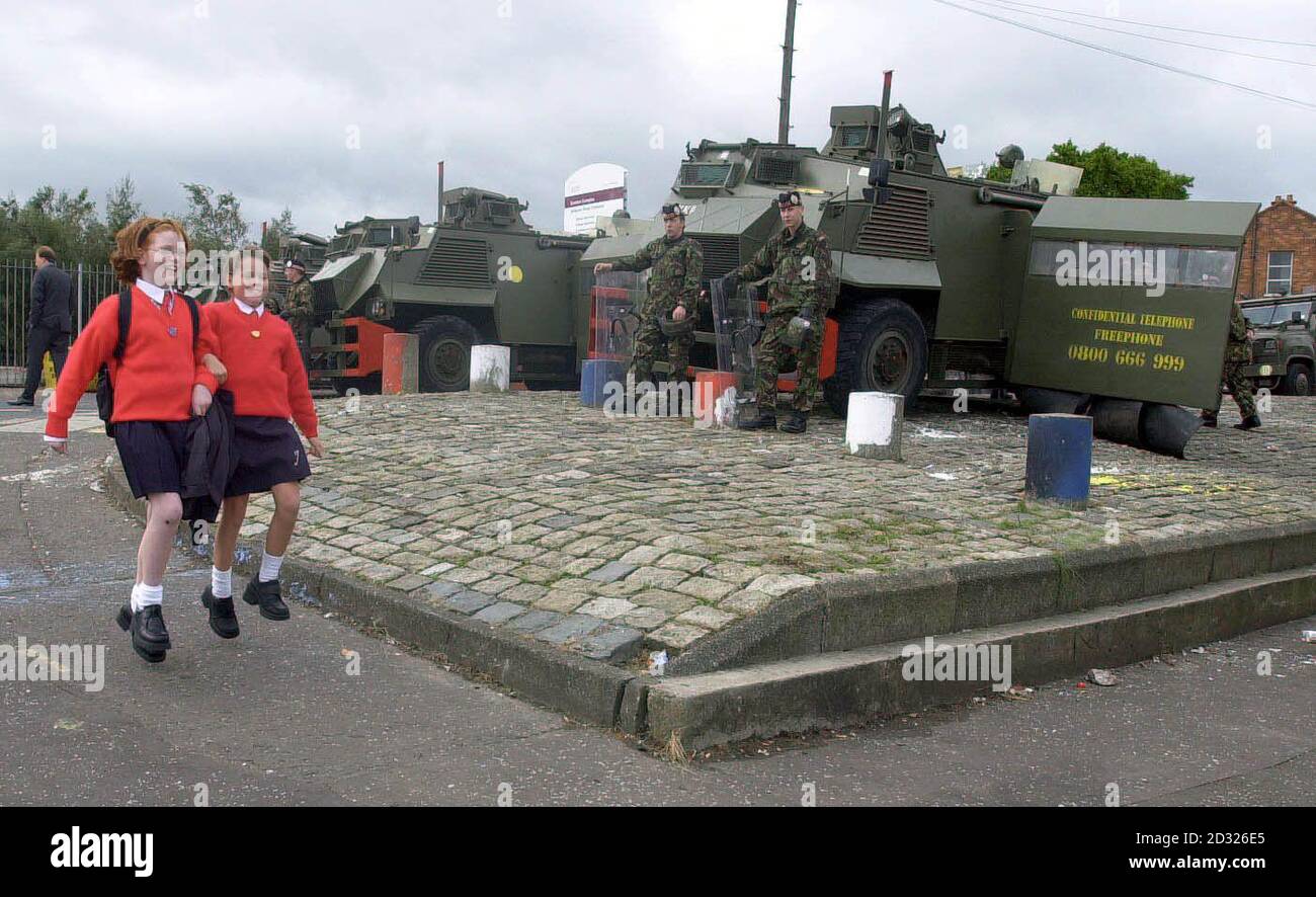 After a tense week for pupils of the Holy Cross Primary School, Belfast, the Catholic girls were able to smile as they skipped away from the protestant Ardoyne Road and the Army Security cordon to enjoy a weekend away from the distressing scenes.  * ...  witnessed each day at the School. Stock Photo