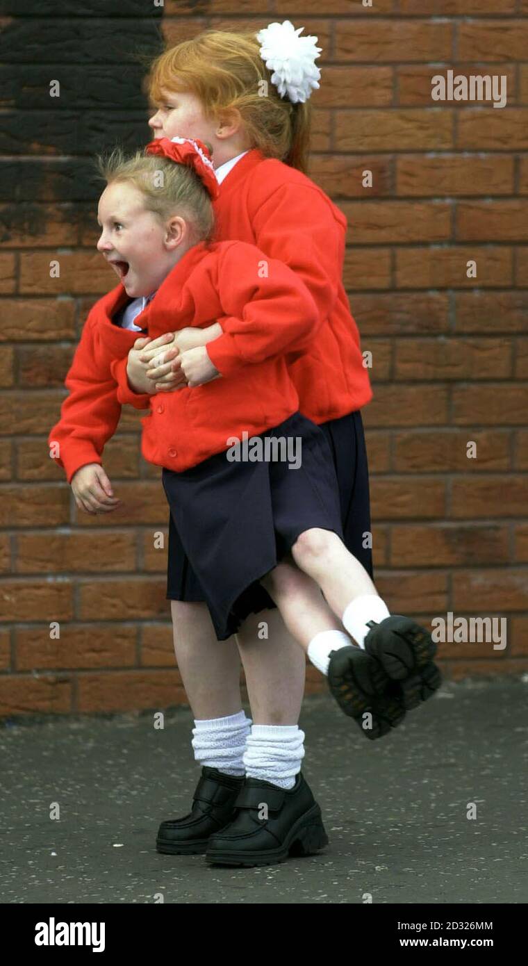 Pupils of the Holy Cross Girls School play as they arrive at school. The children were escorted to the grounds by parents and police through the Protestant Glenbryn estate to the school gates on day six of the protest.   * Loyalists whistled and shouted abuse at parents of Holy Cross Primary School children in north Belfast amid warnings the protest could last indefinitely unless talks get under way to try to end the stand-off. Stock Photo