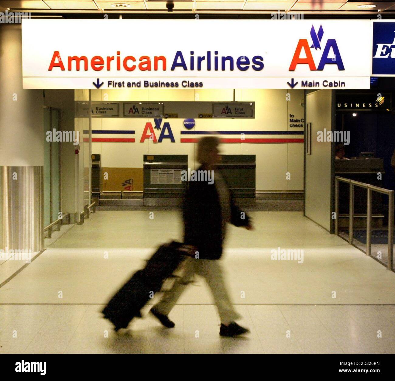 A passenger walks past the deserted American Airlines check-in area at London Gatwick Airport.  All American flights have been grounded following the terrorist attacks in New York City and Washington DC.    * 12/11/01: The 9.8 million passengers through BAA's (British Airport Authority) seven UK airports were 12% down year-on-year in October as the after effects of terrorist attacks on the USA were felt.  Heathrow and Gatwick were heavily affected, with passenger numbers down 20.1% and 12.7% respectively, with North Atlantic traffic through the airports slumping more than 30%. Stock Photo