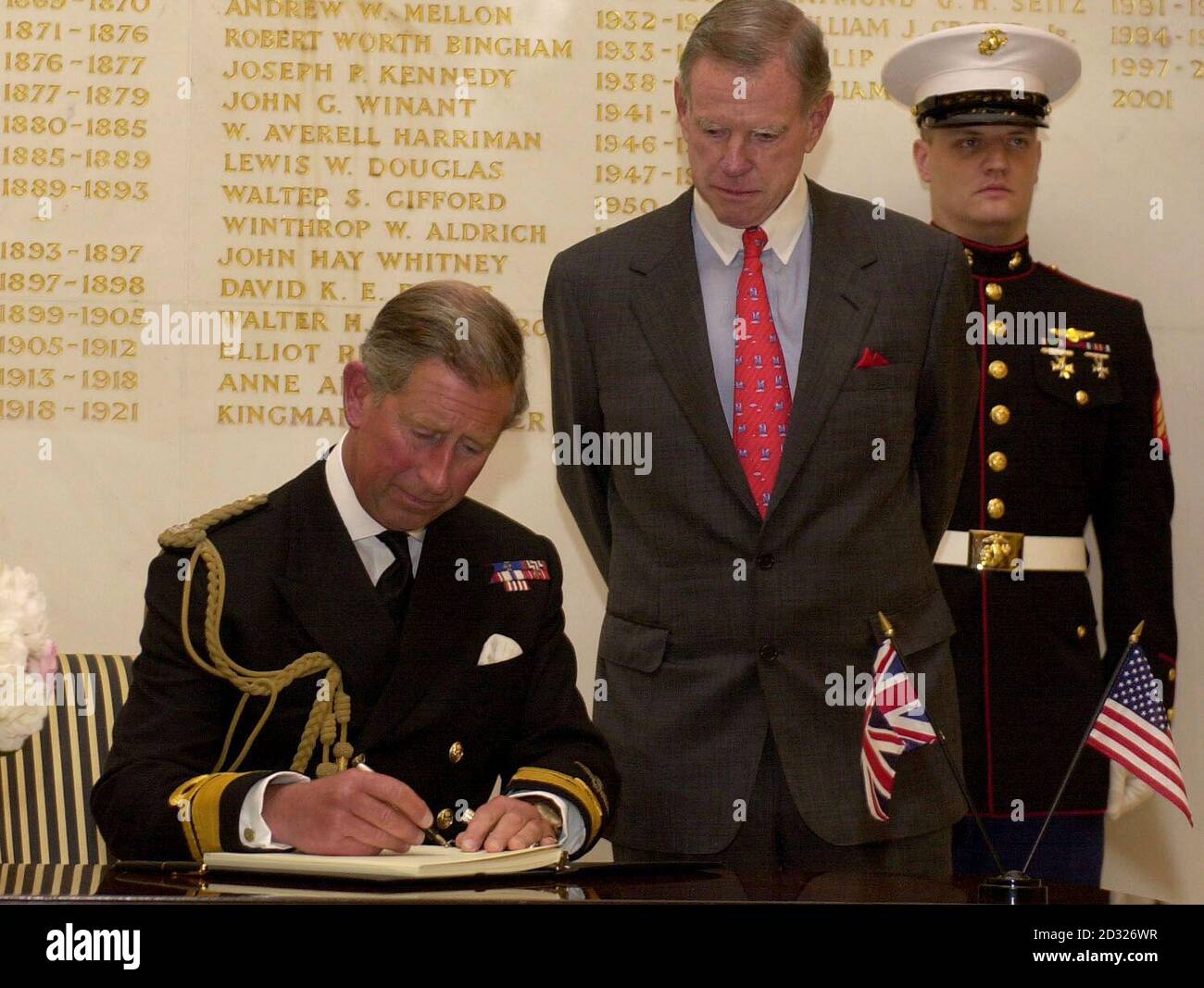 The Prince of Wales signs a book of condolences at the American Embassy in central London with the American Ambassador William Farrish, in memory of those killed by the terrorist attacks in New York and Washington. Stock Photo