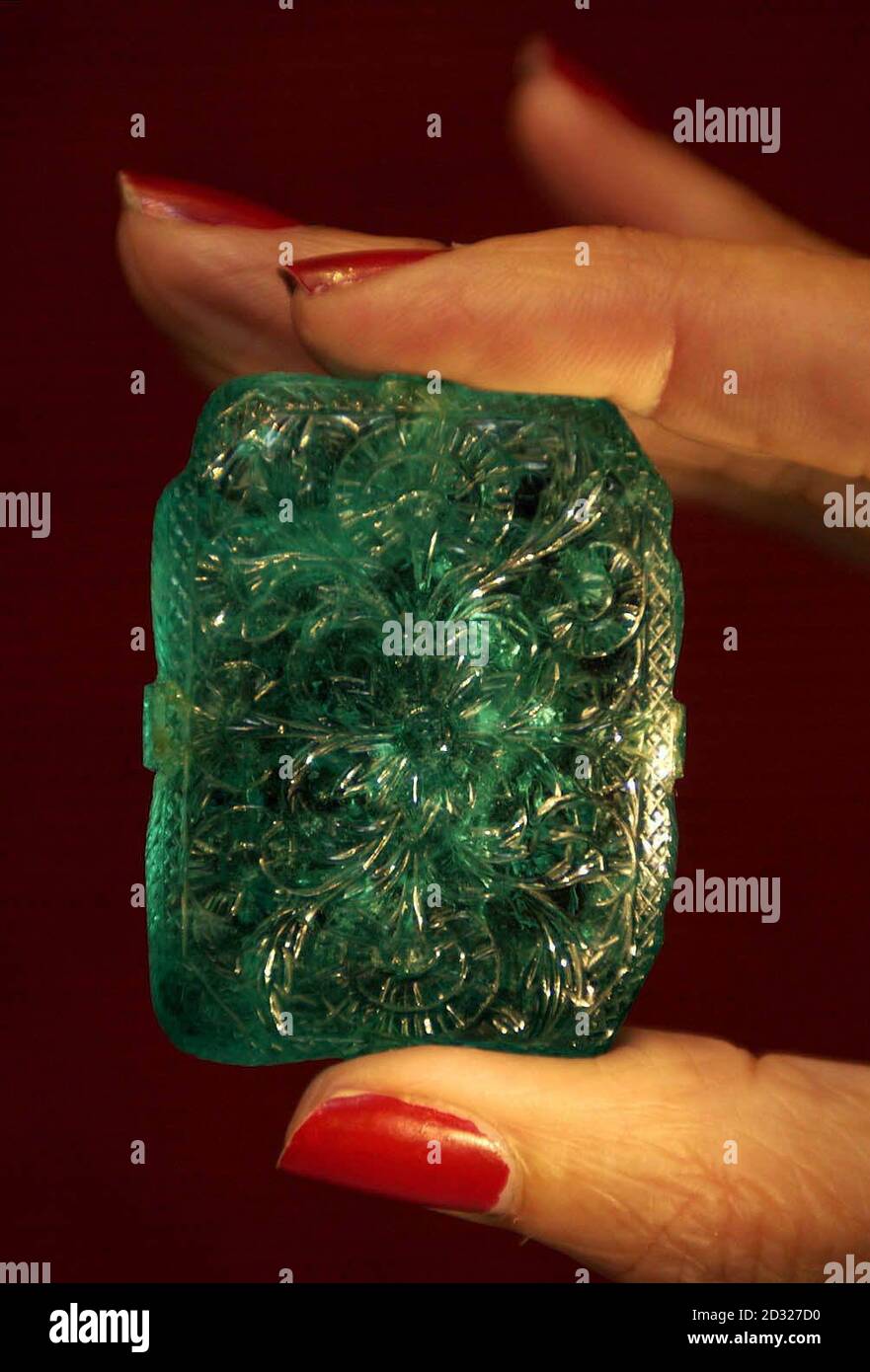 A carved, rectangular cut Colombian Mughal emerald weighing 217.80 carats, known as 'the Mughal', which is expected to reach  1,000,000 in Christie's forthcoming Arts of India auction on 27 September 2001.   *The rare 400-year-old emerald was expected to fetch over  1 million when it went under the hammer at Christie's at an auction of Indian artefacts, Thursday 27 September, 2001. The Mughal Emerald, which weighs over 217 carats, dates from 1695 and is the only known carved, inscribed and dated emerald of the period. Stock Photo