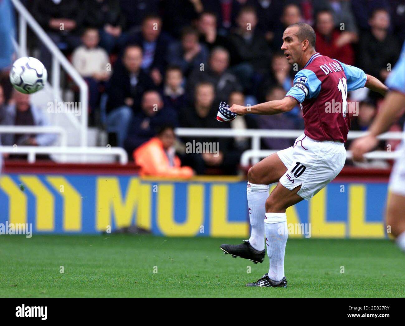West Ham Uniteds Paolo Di Canio holds American Stars and Stripes flag in his left hand as he takes a free kick during the FA Barclaycard Premiership match against Newcastle United at