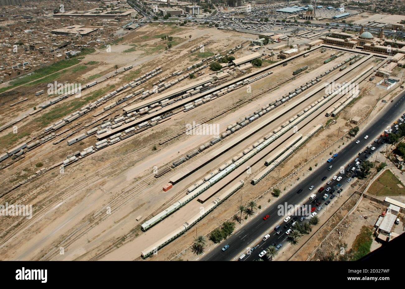 An aerial view of Baghdad Railway station, where passenger commuter coaches and liquified petroleum gas tankers are parked, as seen from a U.S. military helicopter flying over central Baghdad June 4, 2008. Picture taken June 4, 2008.   REUTERS/Erik de Castro (IRAQ) Stock Photo