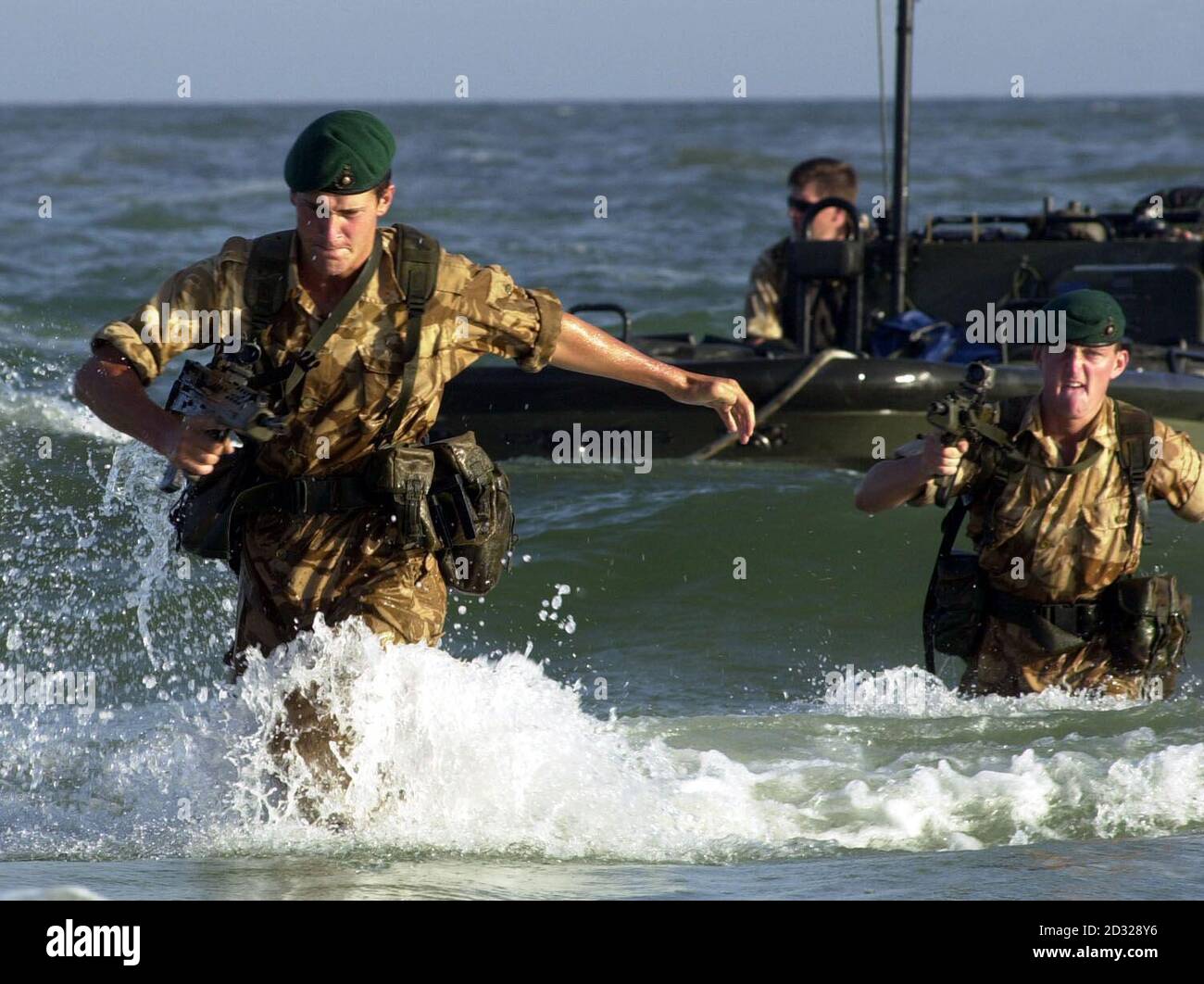 EDITORIAL USE ONLY: Royal Marines from 40 Commando come ashore from an assault boat during an amphibious display in Oman.  *... Two hundred men from 40 Commando, part of 3 Commando Brigade, have been placed on immediate standby for action in Afghanistan and will remain in the Gulf on board HMS Fearless when other troops return from exercise in Oman.   Stock Photo