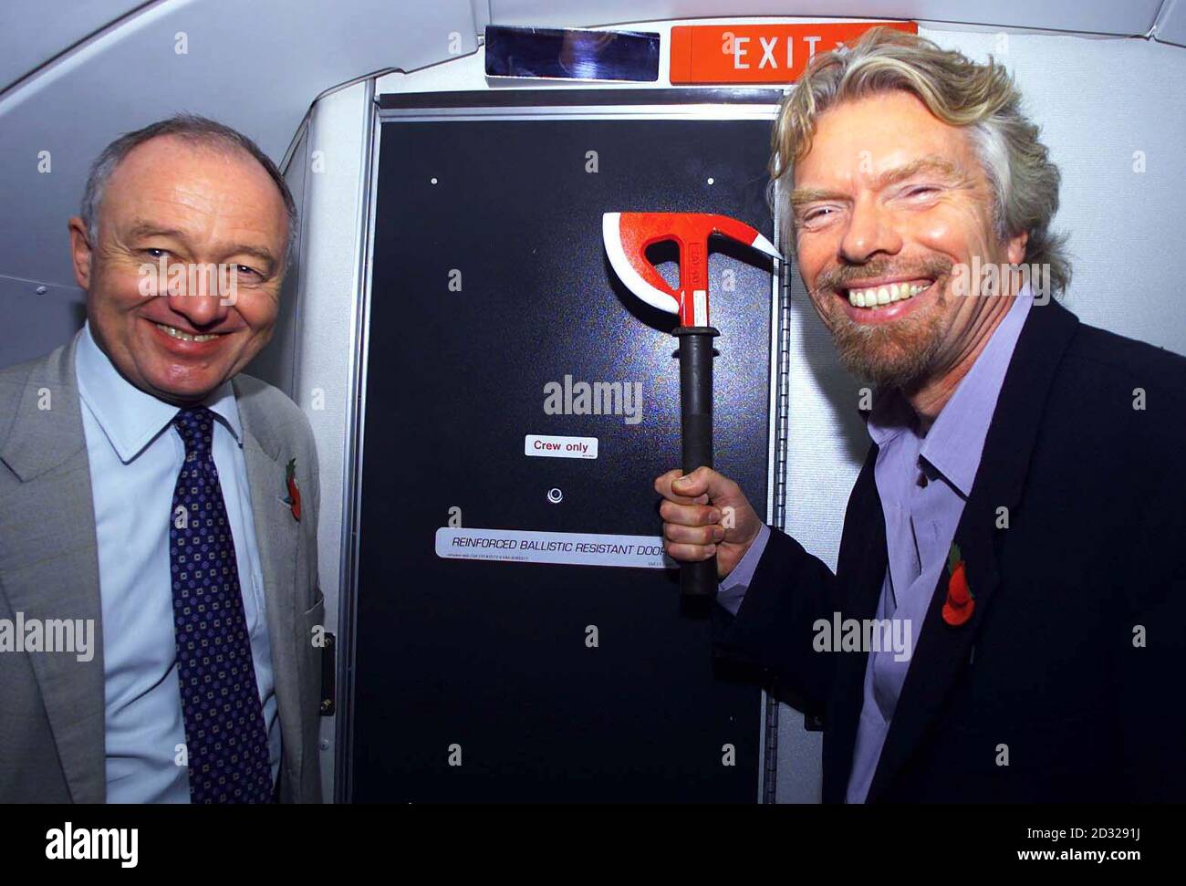 London Mayor Ken Livingstone and Virgin chairman Sir Richard Branson with the new reinforced cockpit door of one of the airline's Boeing 747 aicraft that was being renamed The Spirit of New York at London's Heathrow Airport.  *  Sir Richard Branson, the Virgin Atlantic chairman, said the armour-plated cockpit door was a necessary safety change after the September 11 suicide hijackings which destroyed the World Trade Centre and part of the Pentagon.  In an effort to defy anyone trying to take over control of the aeroplane the doors are bullet, heat and shockproof and have digital locks. In addi Stock Photo