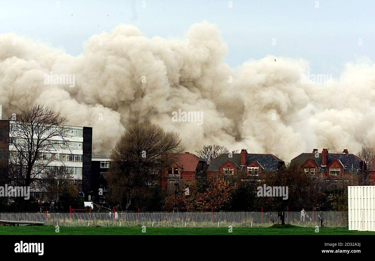 The area smothered in a plume of dust and smoke, where St John's House, the former Inland Revenue, 19-storey tower block in Bootle, Merseyside, had once stood, after the controlled explosion to demolish the buiding.   * In 1995 the Inland Revenue decided to demolish the office block, because 50% of the 2,000 staff has experienced frequent flu like symptons over the past five years, which was thought to be caused by contamination of the ventilation ducts by micro-organisms.  Stock Photo