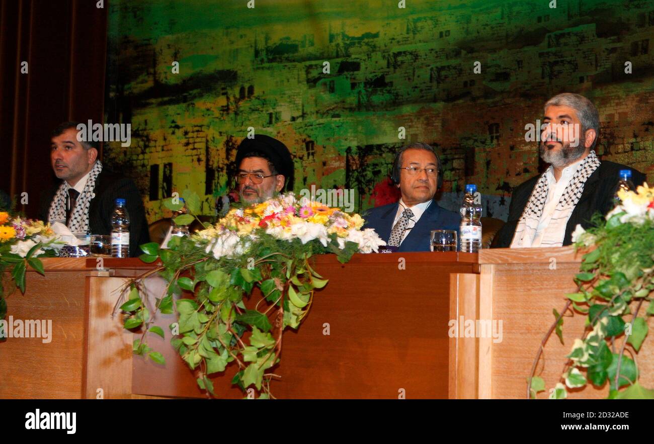 Hamas leader Khaled Meshaal (R), former Prime Minister of Malaysia Mahathir Mohamad (2nd R), Iranian former Interior Minister Ali Akbar Mohtashami and general director the Palestinian Return Centre-London Majed al-Zeer (L) attend the Arab International Congress for the Right of Return of Palestinians, in Damascus November 23, 2008.   REUTERS/Khaled al-Hariri  (SYRIA) Stock Photo