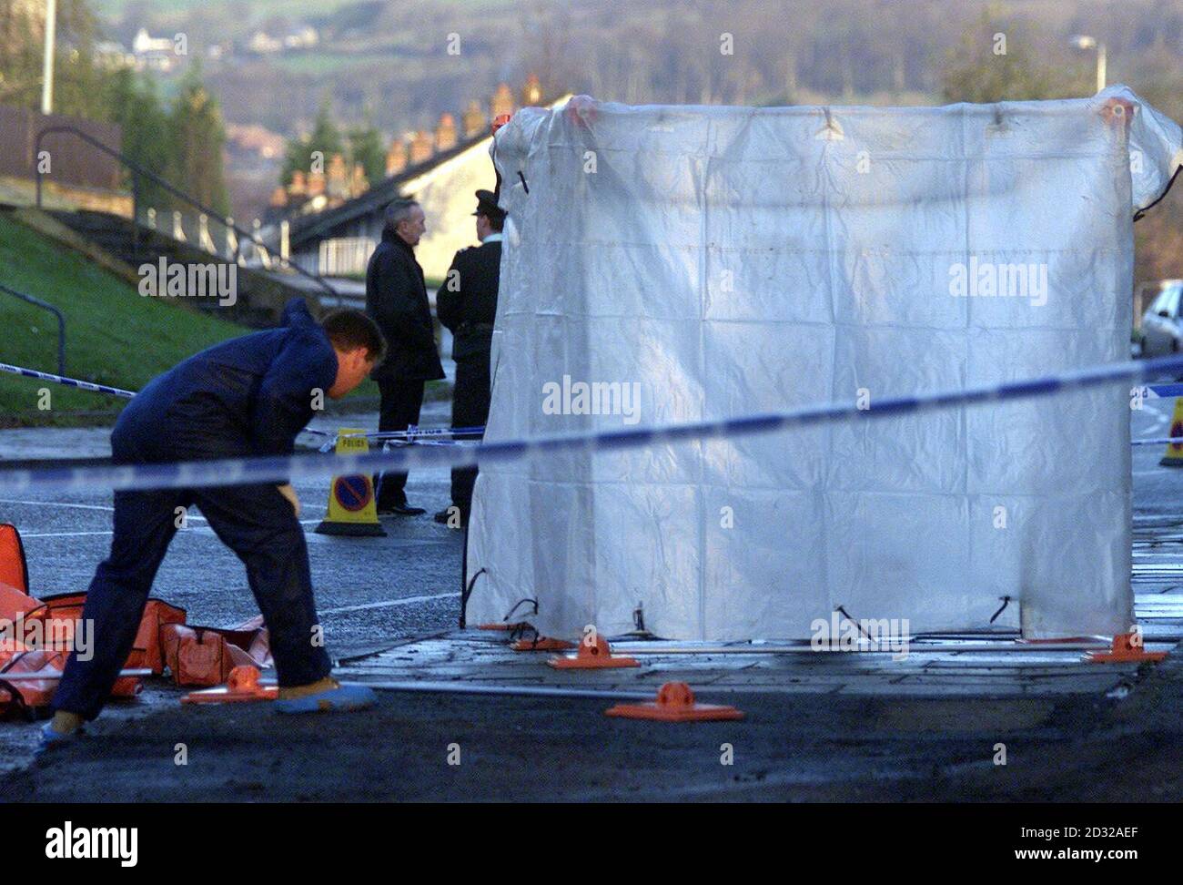 Forensics work at the scene of the shooting on the Forthriver road, North Belfast, where former police agent William Stobie, an ex-Ulster Defence Association quartermaster, was  shot dead  at his home in  north Belfast.   * The murder comes just weeks after his trial for his part in the killing of Mr Finucane collapsed when the prosecution's key witness refused to give evidence. Stock Photo