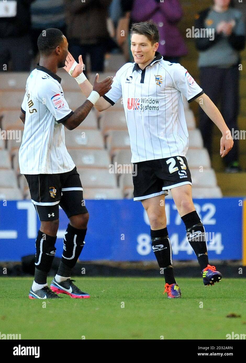 Port Vale's Jennison Myrie Williams (left) congratulates team-mate Ryan Burge on scoring their opening goal during the npower Football League Two match at Vale Park, Stoke On Trent. Stock Photo