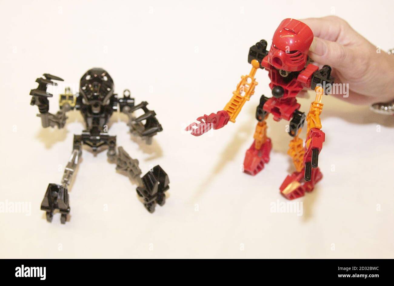 Onua (left) and Tahu, two of LEGO's Bionicles, are displayed at Toy Fair trade show inside ExCel exhibition centre, east London. The LEGO TECHNIC Bionicle has been a consistent best seller throughout the year.  *   and has overcome the hype of Harry Potter to win the British Association of Toy Retailers' Toy of the Year 2001-2002. Stock Photo