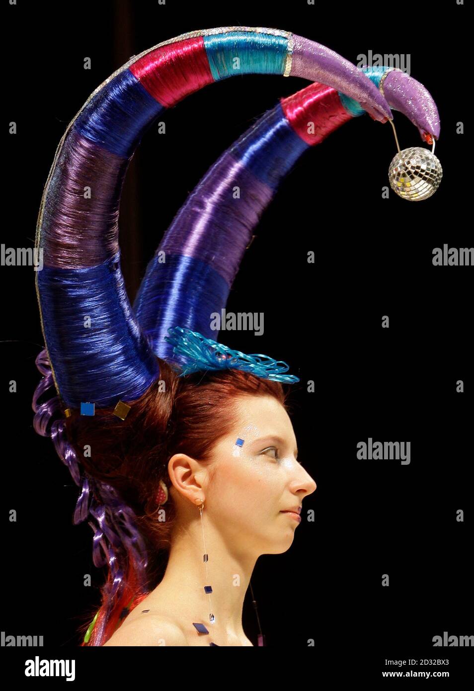 A model presents a creation during a hair art show at the international beauty festival A model presents a creation during a hair art show at the international beauty festival