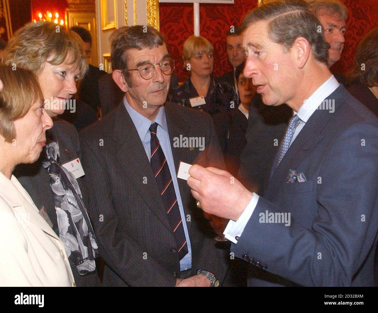 The Prince of Wales meets, (2nd and 3rd left), Graham and Patricia Brazil, from Exeter at a reception for farming families and communities at St James' Palace, London, today. Stock Photo