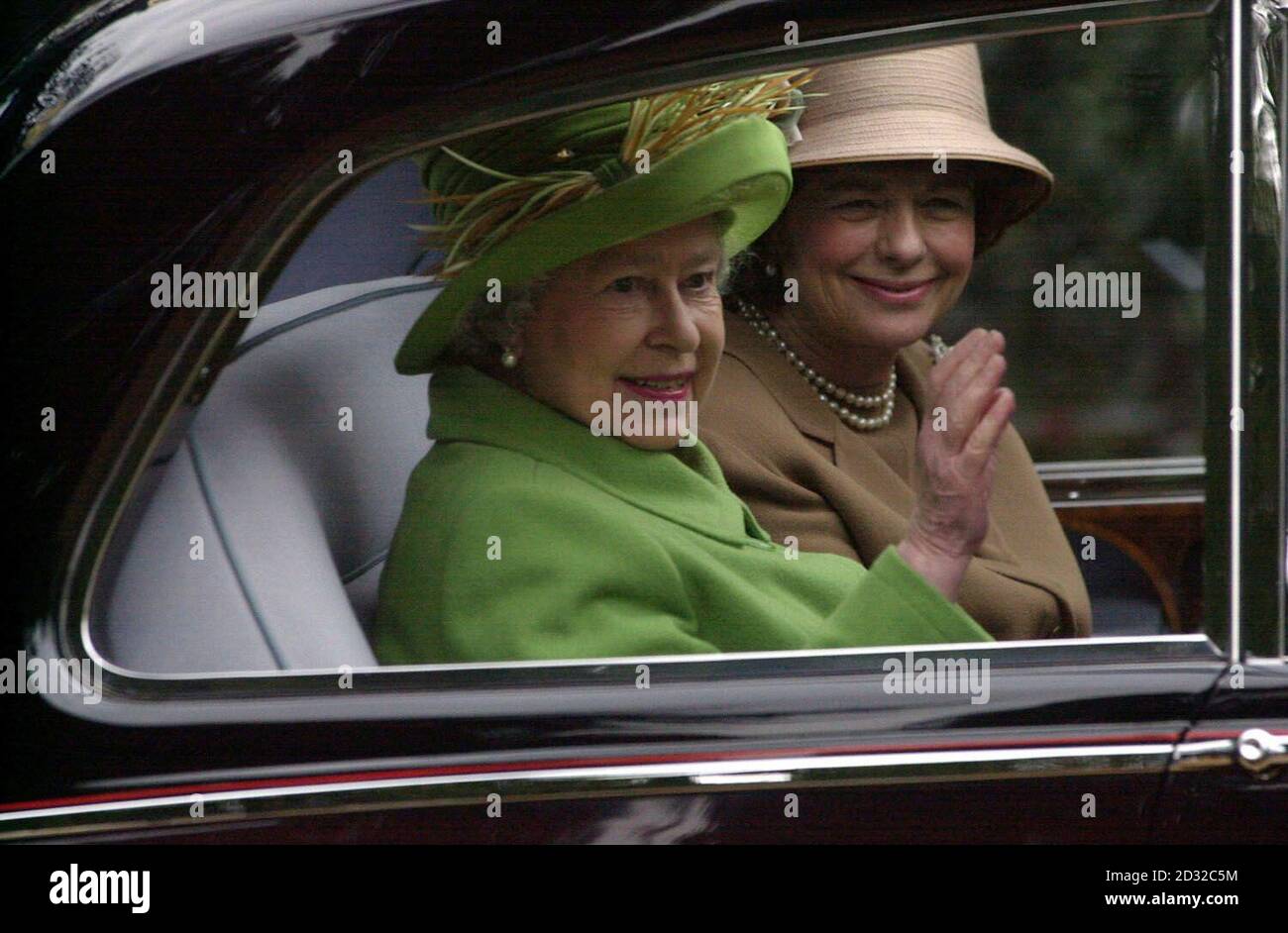 Britain's Queen Elizabeth II waves to wellwishers as she leaves her