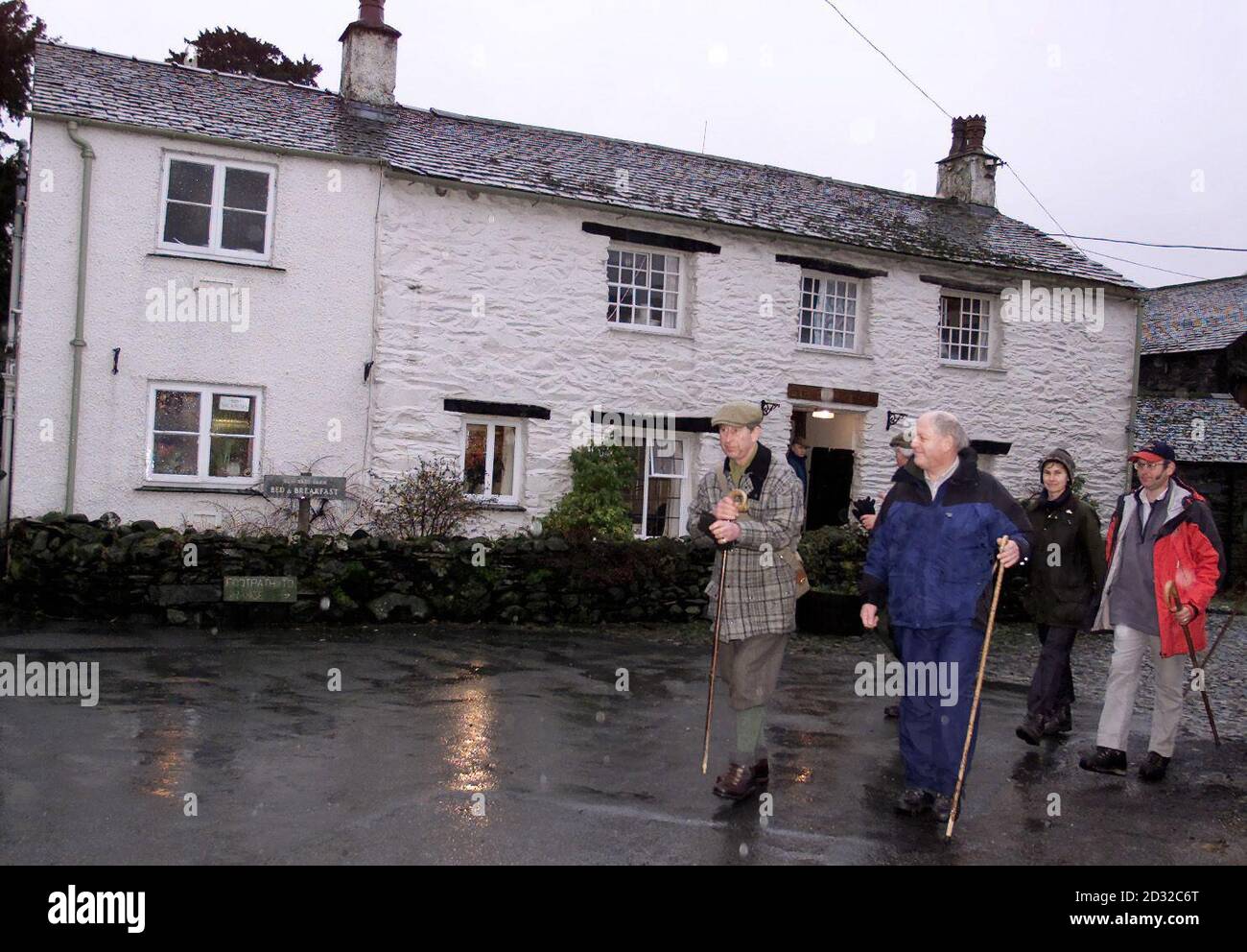 The Prince of Wales walks with friends, as he leaves for the fells from the family-run Yew Tree Farm Bed & Breakfast in Rosthwaite, near Keswick in the Lake District, where he stayed for two nights during a brief holiday in the area.    * The Prince decided to book-in to the B&B to support the rural economy in the wake of the foot and mouth epidemic, which badly affected the Lake District. Stock Photo