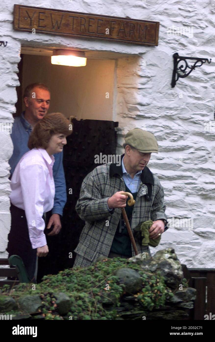 Hazel and Joe Relph watch as the Prince of Wales heads for the fells, from their family-run bed and breakfast in Rosthwaite, near Keswick in the Lake District, where he stayed for two nights during a brief walking holiday in the area.   * The Prince decided to book-in to the B&B to support the rural economy in the wake of the foot and mouth epidemic, which badly affected the Lake District. Stock Photo