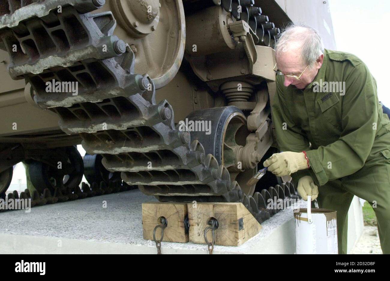 Peter Bromwich from St. Albans touches up the Sexton 25 pounder, Self Propelled Gun in Ver-Sur Mer, France. Matthew Kiln, 46, the son of a D-day veteran, took the Sextant self-propelled gun aboard a ferry at Portsmouth. * ... on his journey to donate it to the Ver sur Mer museum in Normandy. The tank will be placed overlooking Gold Beach - the location of a major surge of the British D-day invasion which Mr Kiln's father Robert, who died in 1997 at the age of 77, took part in. Now to commemorate the bravery of his father, who served in the Bedfordshire and Hertfordshire Yeomanry, and all Stock Photo