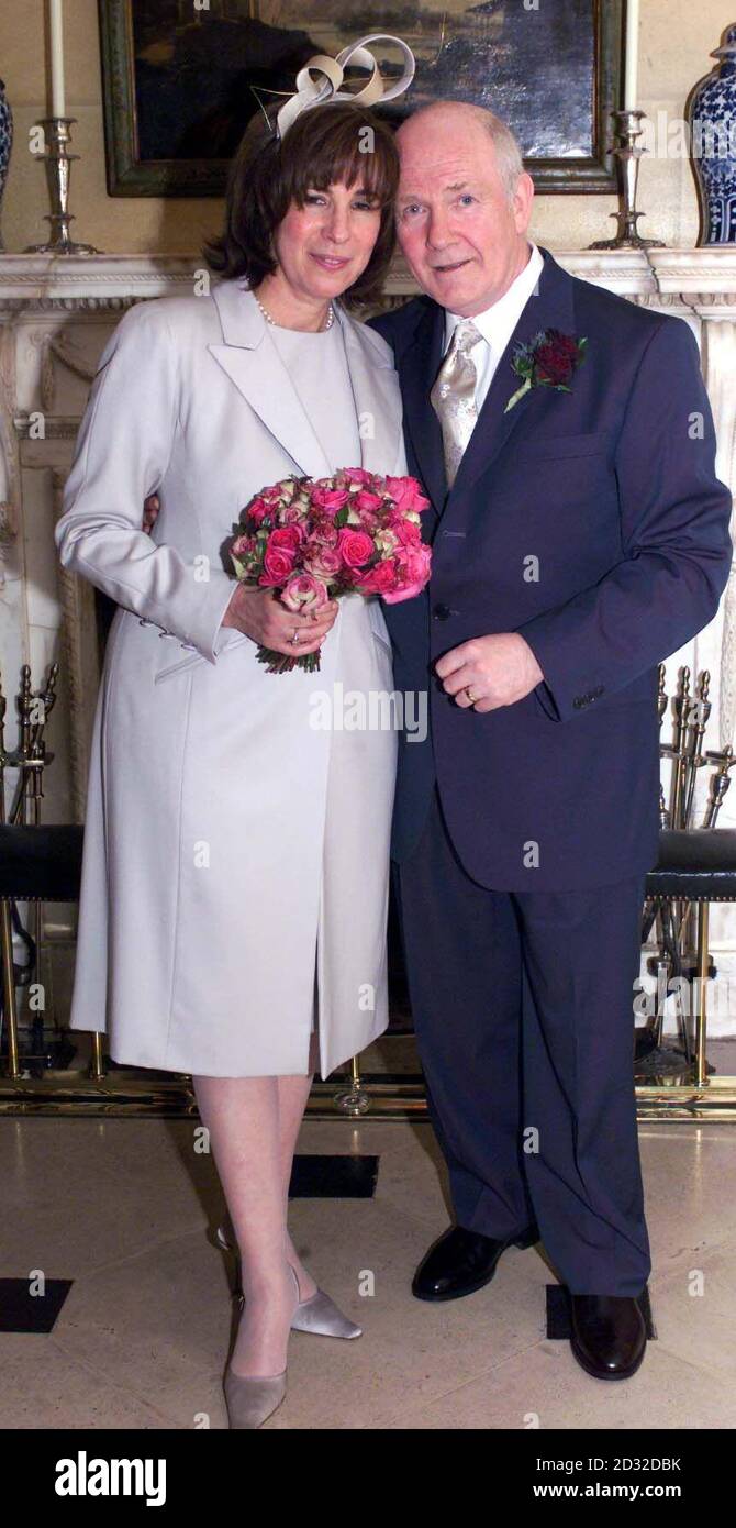 Northern Ireland Secretary Dr John Reid with his Brazilian-born wife Carine Adler after the couple was married in central London. His wedding ceremony was a private family occasion attended by around 70 family and close friends. Stock Photo