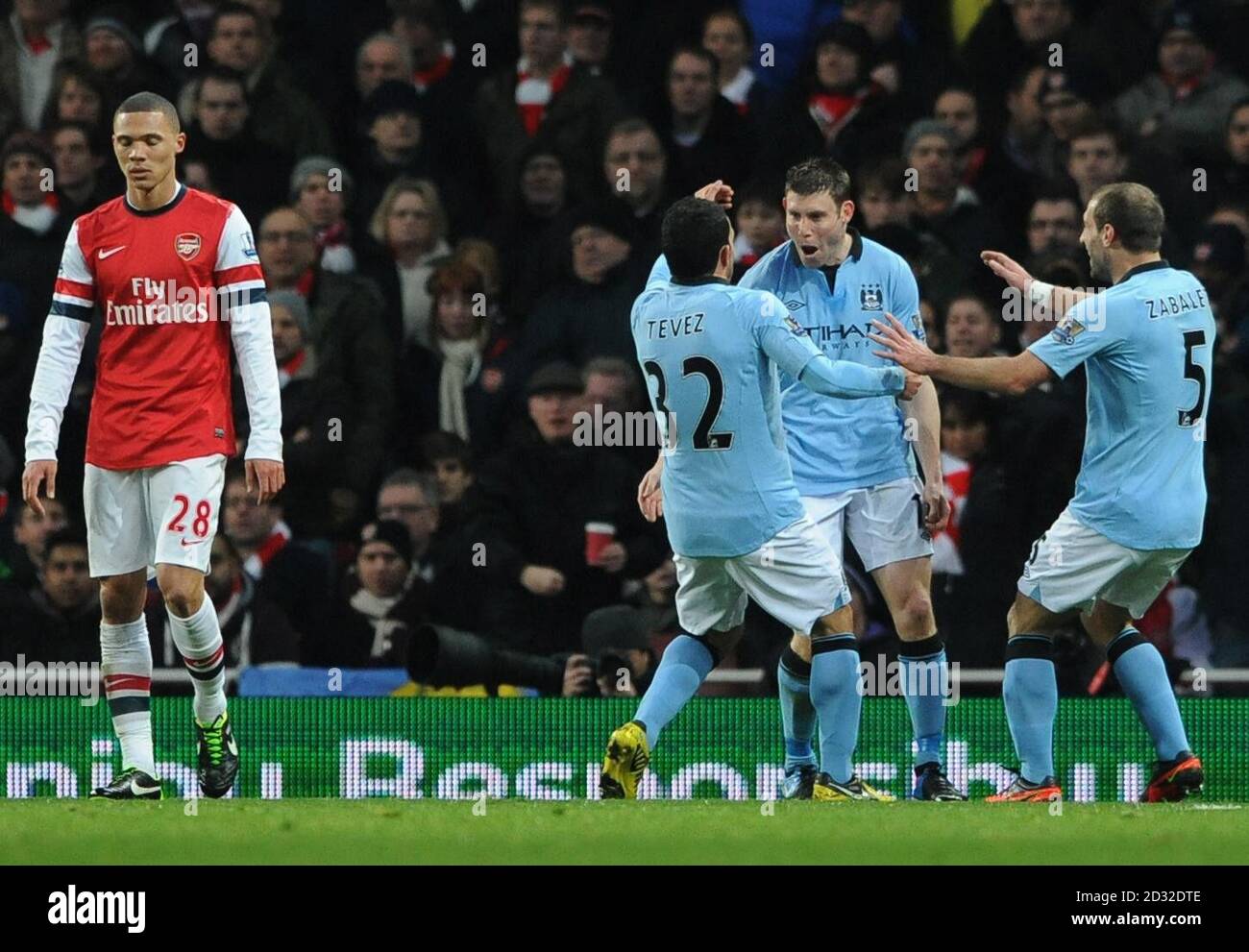 Manchester City's James Milner (second right) celebrates after scoring his team's opening goal during the Barclays Premier League match at The Emirates Stadium, London. PRESS ASSOCATION Photo. Picture date: Sunday January 13, 2013. See PA story SOCCER Arsenal. Photo credit should read: Anthony Devlin/PA Wire. Stock Photo