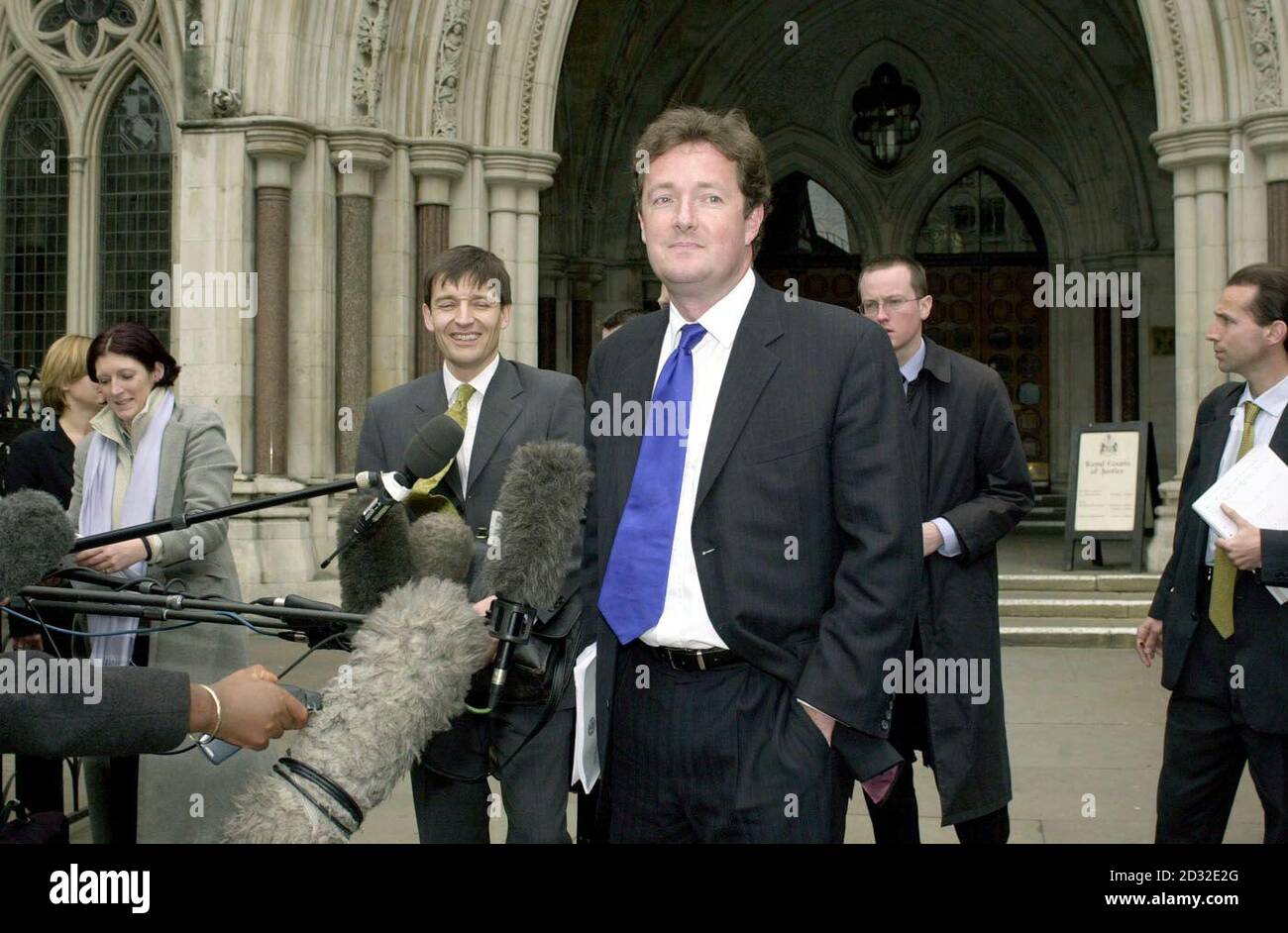 Piers Morgan (centre), editor of The Mirror, leaves the High Court in London after supermodel Naomi Campbell won  3,500 damages from the newspaper following a ruling that it acted in breach of confidence in publishing details of her therapy at Narcotics Anonymous. Stock Photo