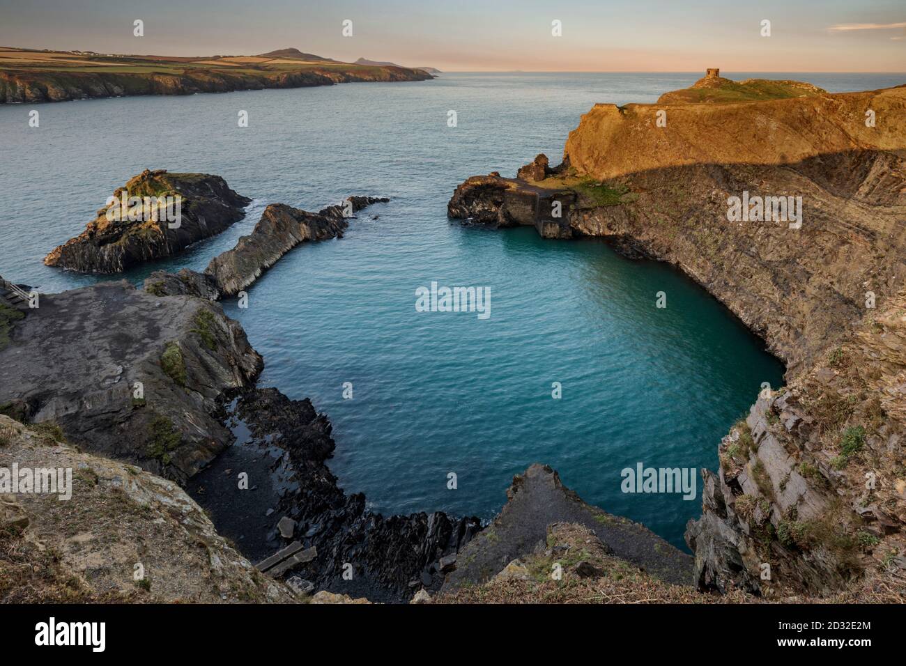 The Blue Lagoon at Abereiddi is one of the best examples in Pembrokeshire of a sea quarry, and popular for coasteering, swimming and diving. Stock Photo