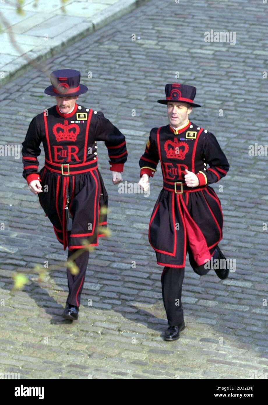 Yeoman Warders (Beefeaters), Chris Morton (left) and Vic Lucas train for the London Marathon at the Tower Of London.    *The two will swap their pikes for running shoes on Sunday to raise cash for The British Limbless Ex-Serviceman's Association and St Dunstan's for the Blind.   Stock Photo