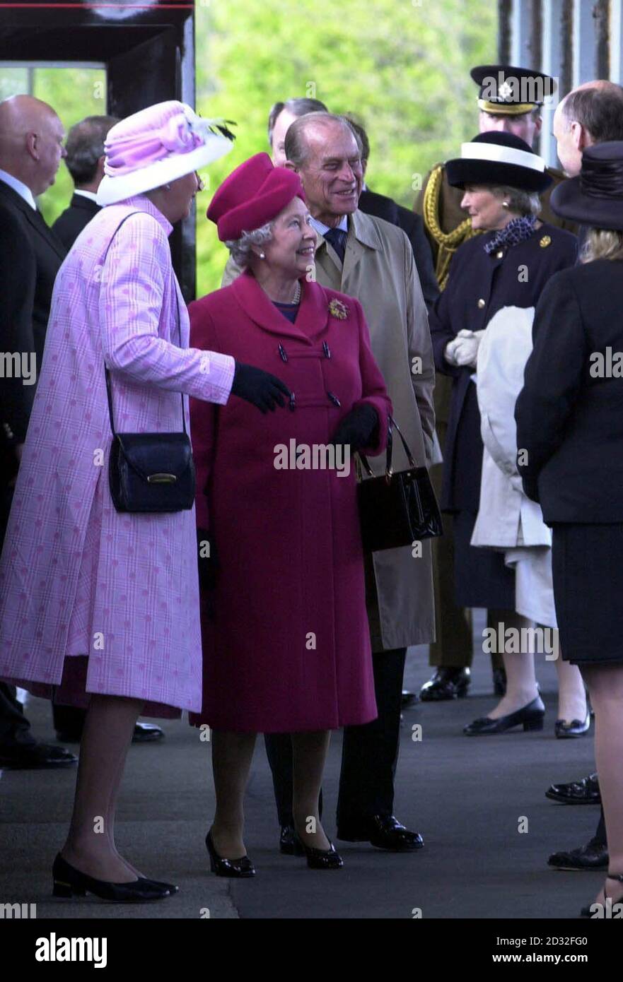 Britain's Queen Elizabeth II with the Duke of Edinburgh and the Lord Lieutenant of Cornwall Lady Mary Holborow (left) on the platform at Falmouth harbour on the first day of her nationwide Golden Jubilee tour which is starting with a two-day visit to the West Country. * In the coming weeks, the 76-year-old monarch will visit every region of England, Scotland, Wales and Northern Ireland. Stock Photo
