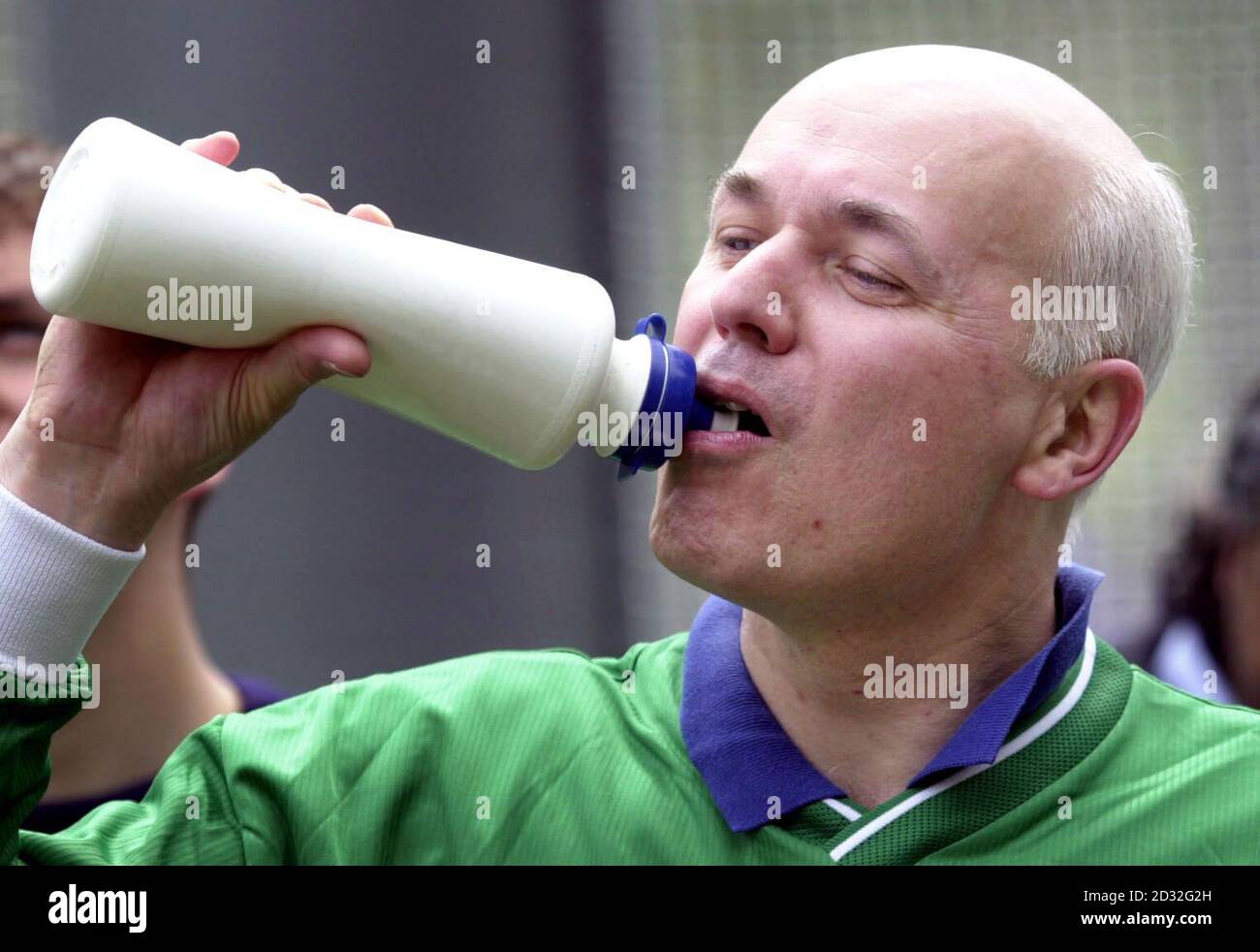 Conservative Party leader Iain Duncan Smith takes a drinks break during a football game for the Parliament team as part of the Nation's football Festival in Westminster, London. Other teams involved in the festival comprise of asylum seekers and refugees. Stock Photo