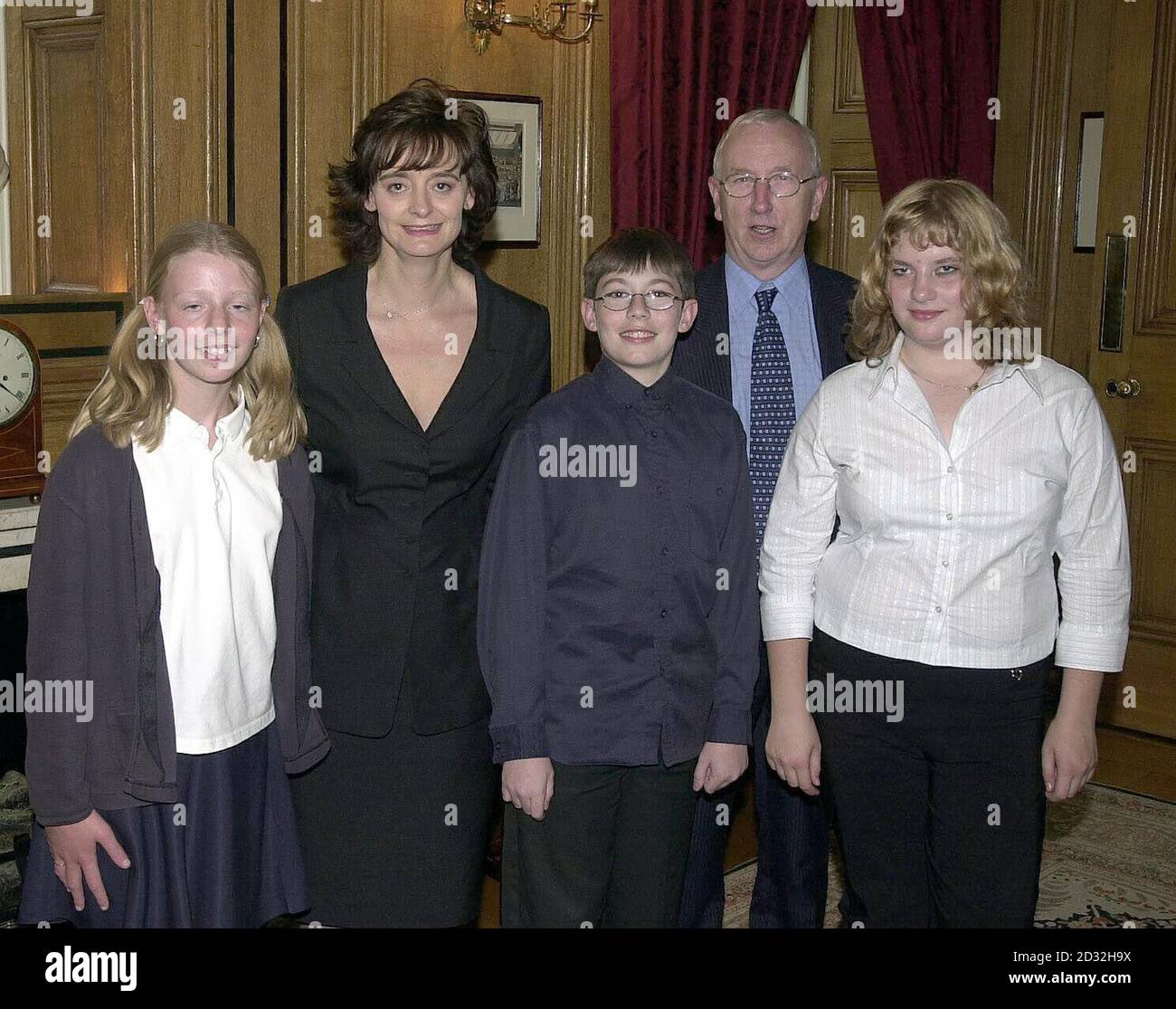 Cherie Blair, the wife of British Prime Minister Tony Blair,  host's a childrens tea party at No.10 Downing St. Cherie with Leeds East MP George Mudie and children from his constituency (l/r)  Laura Balmforth, Christopher Chadwick and Emma Foster. Stock Photo