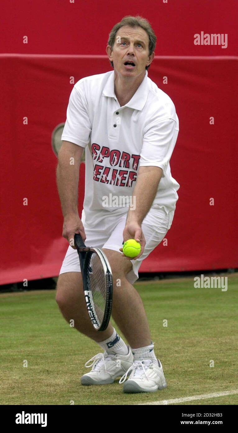 British Prime Minister Tony Blair plays tennis for Sport Relief during the Stella Artois Championships at Queen's Club, London. Stock Photo