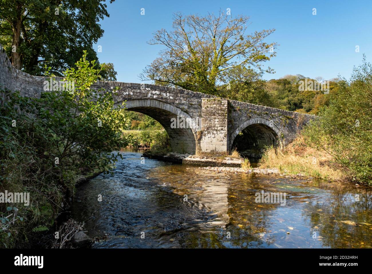Nevern Bridge is a Grade II listed bridge that spans the River Nevern in the small village of Nevern, Pembrokeshire, Wales. Stock Photo