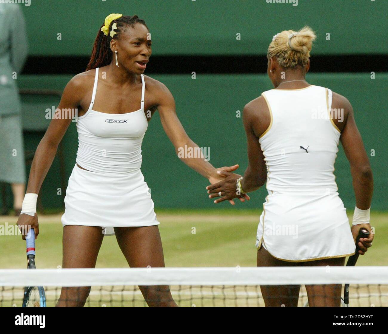 EDITORIAL USE ONLY, NO COMMERCIAL USE. Serena and Venus Williams from the USA in action in the Ladies' Doubles Final at Wimbledon which they won in straight sets 6:2/7:5 against Virgina Ruano Pascual from Spain and Paola Suarez of Argentina. * The Williams sisters competed against each other in the Ladies' Singles Final yesterday, with Serena beating her older sister in straight sets. Stock Photo