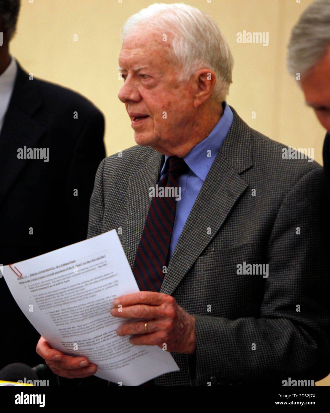 Former U.S. President Jimmy Carter looks at journalists during a news conference in Khartoum April 17, 2010. Sudan's first multi-party elections in 24 years fell short of international standards, two international observation missions said on Saturday in the first authoritative judgments on the poll. REUTERS/Zohra Bensemra (SUDAN - Tags: POLITICS ELECTIONS PROFILE) Stock Photo