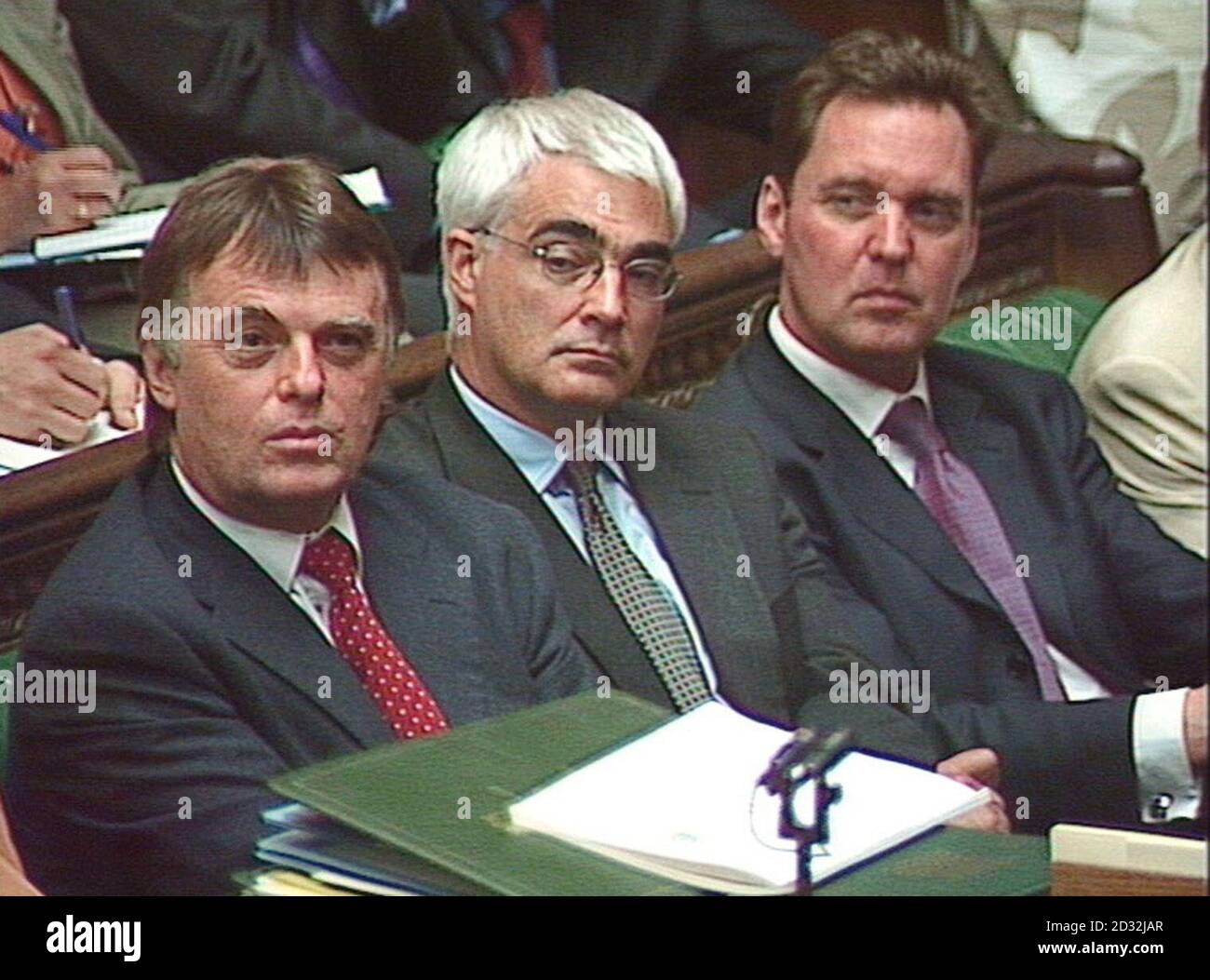 Government Ministers Andrew Smith (Work and Pensions), Alistair Darling (Transport) and Alan Milburn (Health) listen to British Chancellor of the Exchequer Gordon Brown in the House of Commons in, where he outlined his Comprehensive Spending Review.   * Education will get the main share of his  90 billion package, with the Home Office, Defence, Overseas Aid and Transport all sharing in the spending boost. Stock Photo